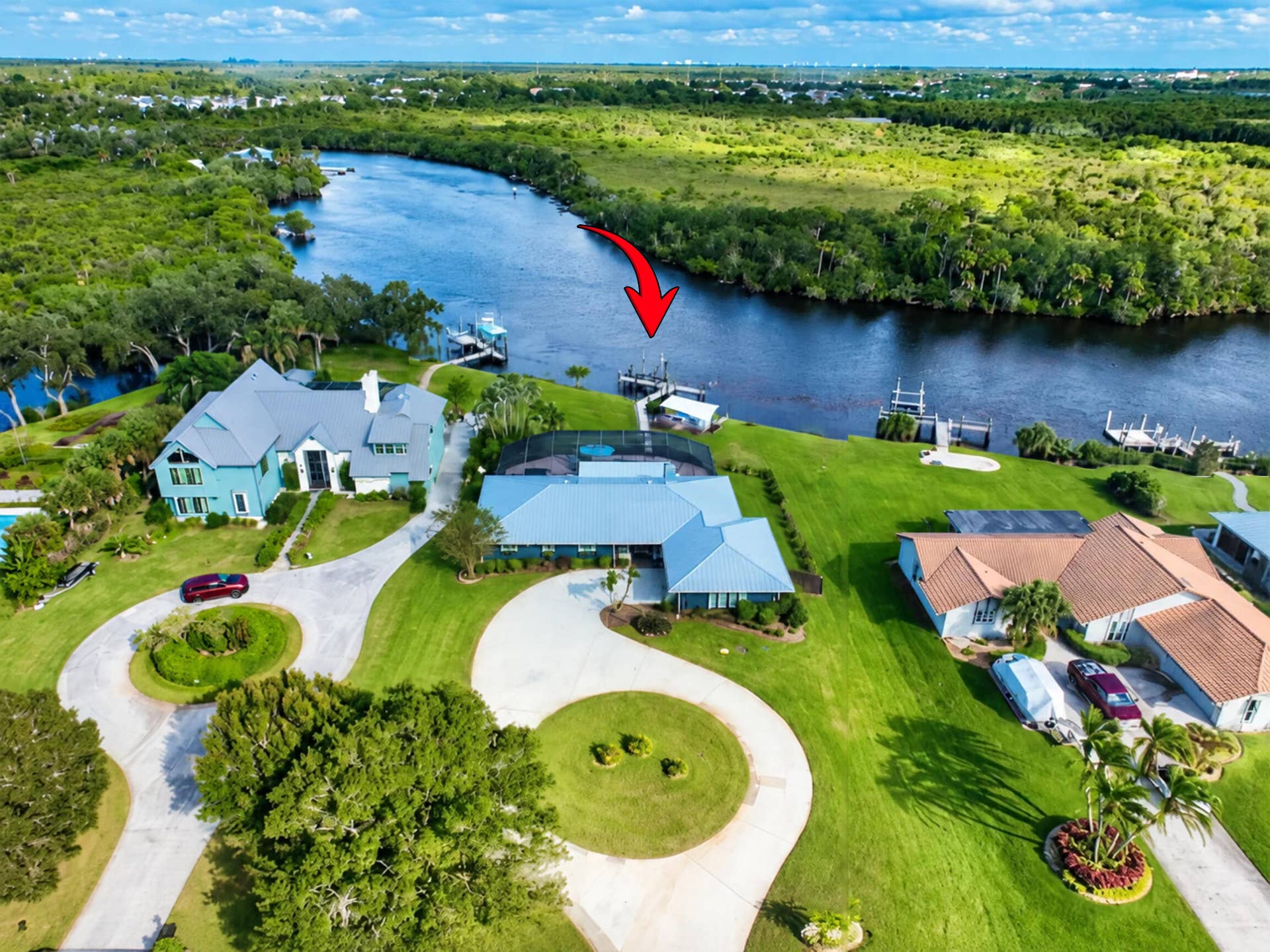 Over 0.6 acres, oversized circular drive...amazing river views from every angle!