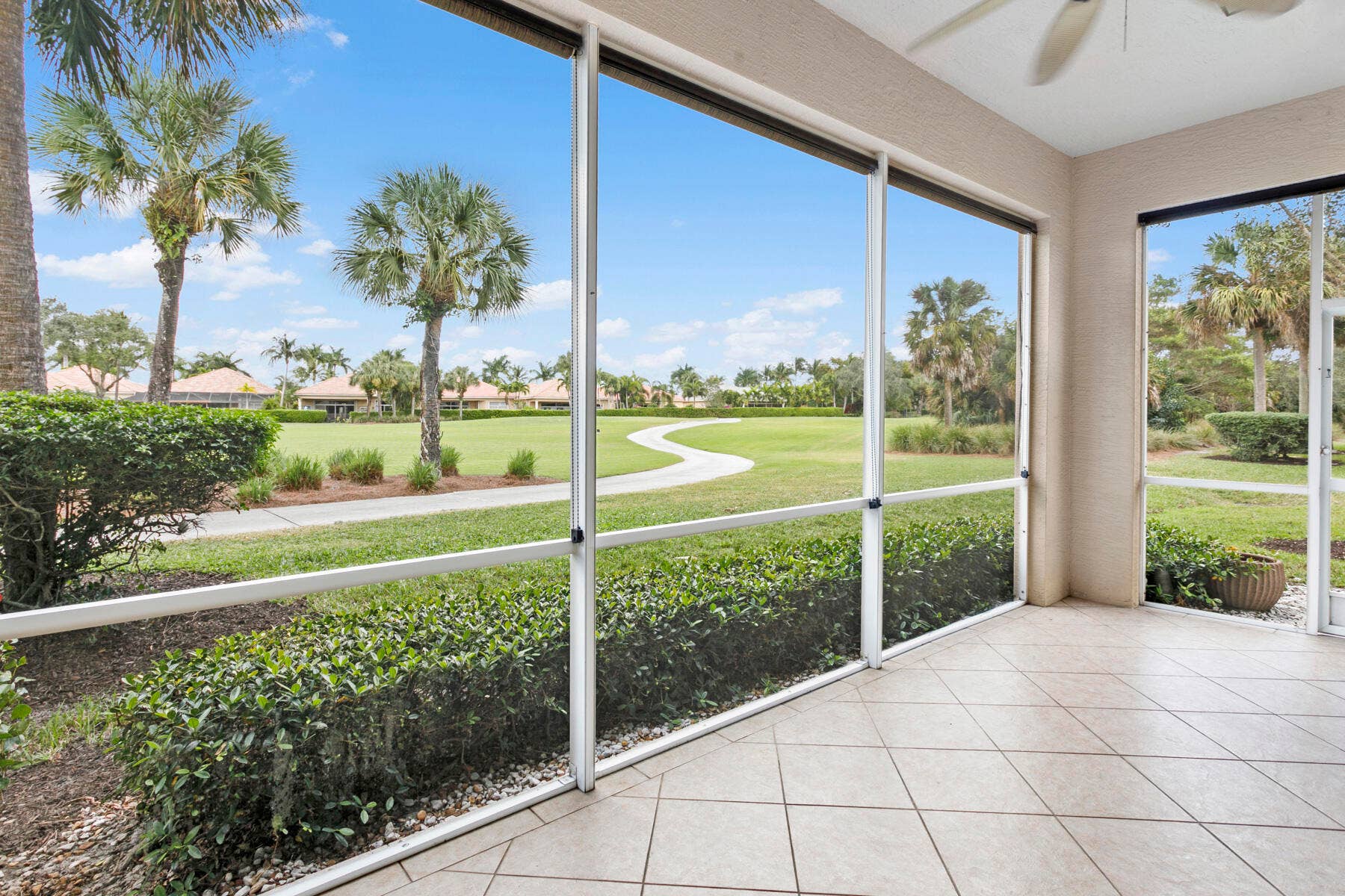Screened patio with golf-front views