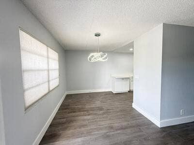 345 WELLINGTON H, #345, West Palm Beach, FL 33417 Modern dining room chandelier.