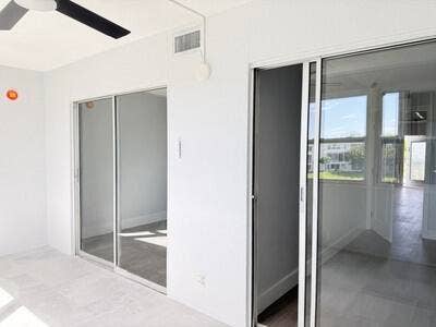 345 WELLINGTON H, #345, West Palm Beach, FL 33417 Access to patio from both bedrooms.