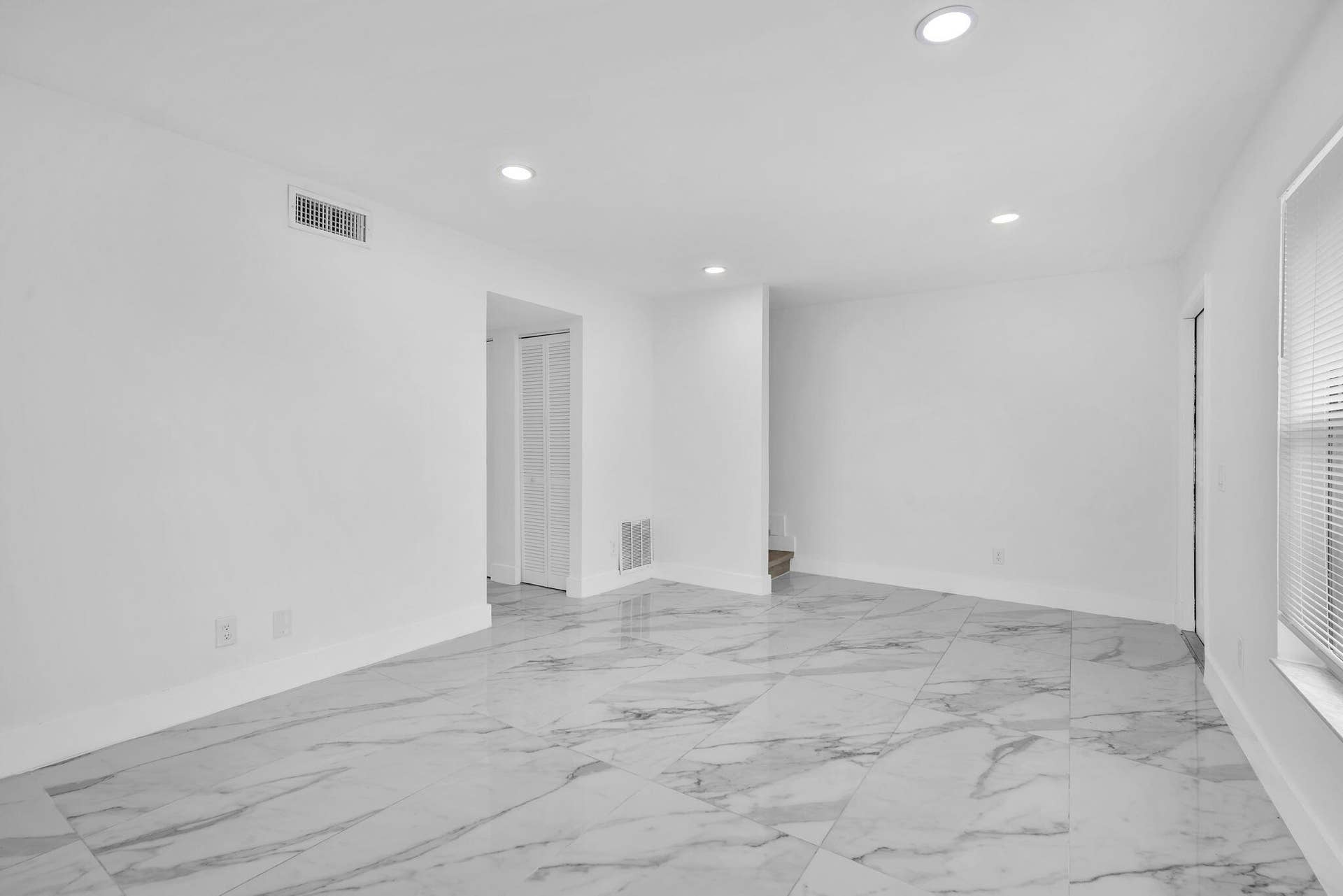 4162 SW 65th Avenue, #84, Davie, FL 33314 Large-format tile flooring with marble-patterned finish, recessed ceiling lighting, and crisp white wall finishes