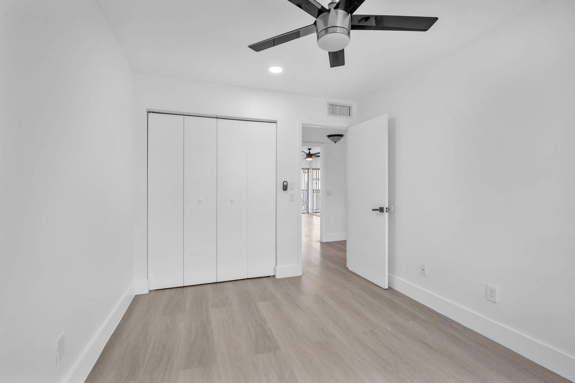 4162 SW 65th Avenue, #84, Davie, FL 33314 Room featuring wood-finish flooring, recessed lighting, a modern ceiling fan with integrated light, and a four-panel closet door