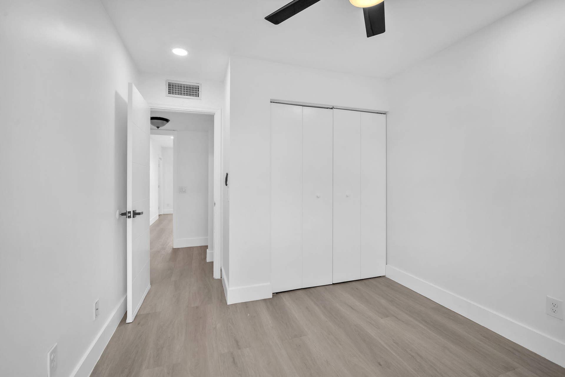 4162 SW 65th Avenue, #84, Davie, FL 33314 Room featuring wood-finish flooring, white bi-fold closet doors, recessed lighting, and a ceiling fan with integrated light