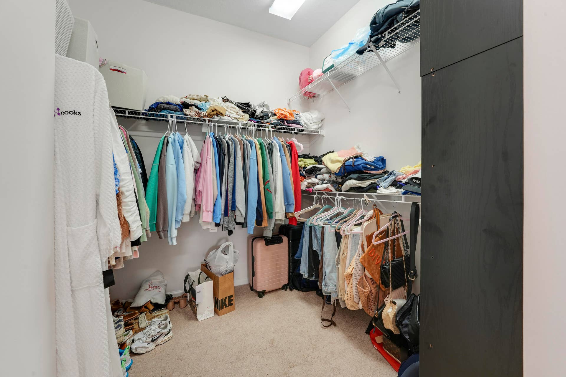 4326 Cascada Circle, Hollywood, FL 33024 Walk-in closet featuring tiered wire shelving and neutral wall-to-wall carpeting
