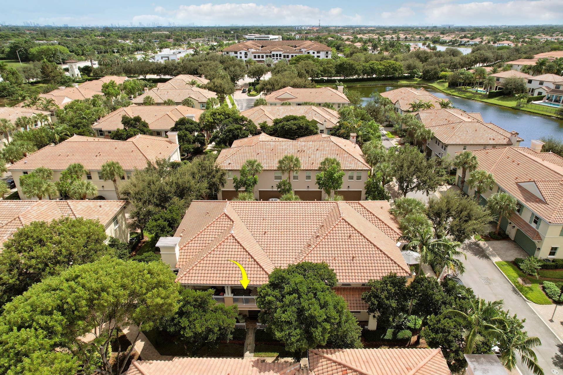 4326 Cascada Circle, Hollywood, FL 33024 Aerial perspective of multi-story residence featuring a tile roof and a covered balcony