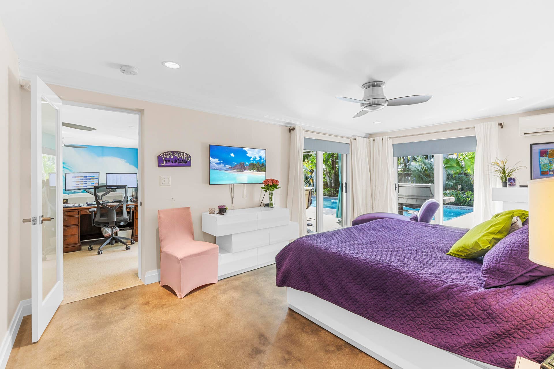 2317 NW 6th Avenue, Wilton Manors, FL 33311 Polished concrete flooring, ceiling fan with integrated lighting, recessed lighting, and sliding glass doors with exterior pool access