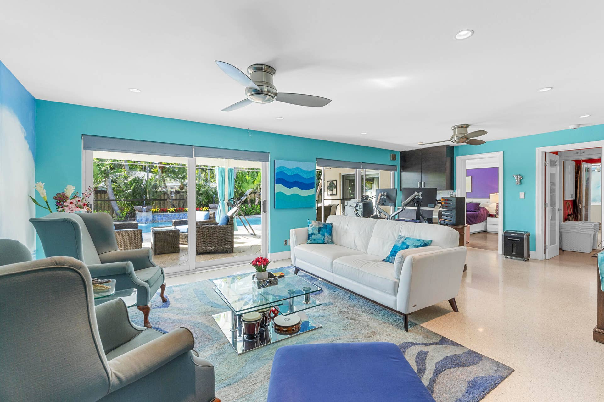 2317 NW 6th Avenue, Wilton Manors, FL 33311 Living area featuring sliding glass doors, recessed lighting, ceiling fans, and polished stone flooring
