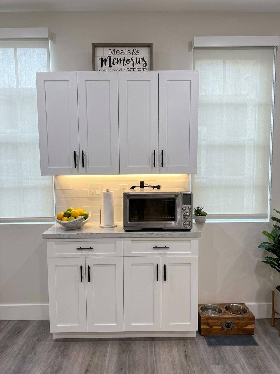 2941 NE 185TH Street, #1303, Aventura, FL 33180 Shaker-style white cabinetry with matte black hardware, stone-surface countertop, subway tile backsplash, under-cabinet task lighting, and wood-finish flooring