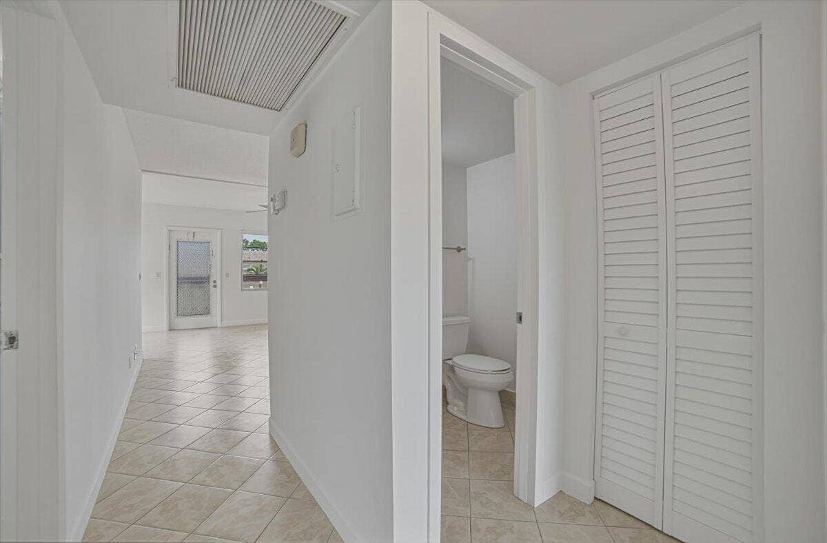 Hallway facing 1/2 bath