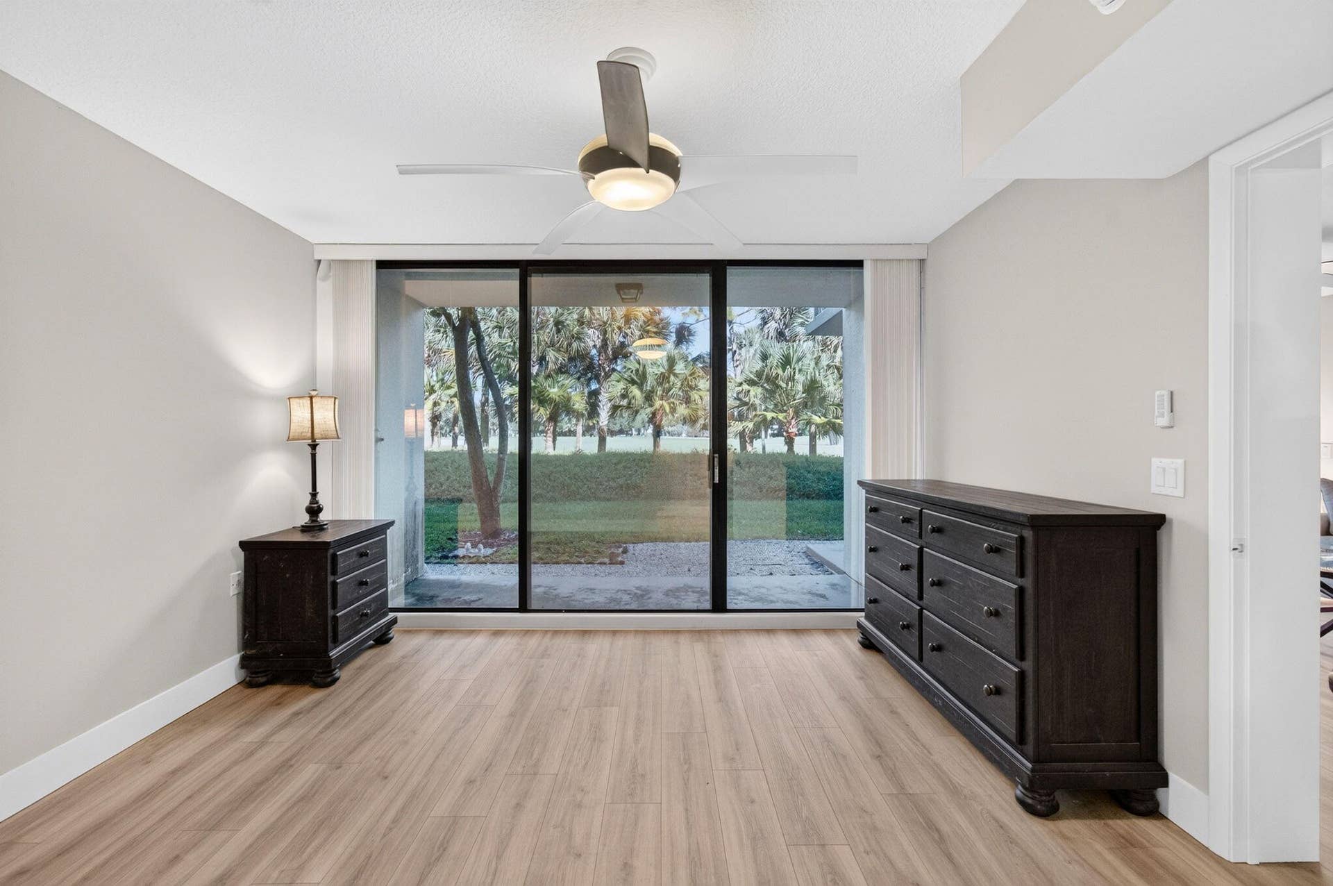 6169 Balboa Circle, #103, Boca Raton, FL 33433 Newer laminate floors walk out patio with peaceful views of the golf course