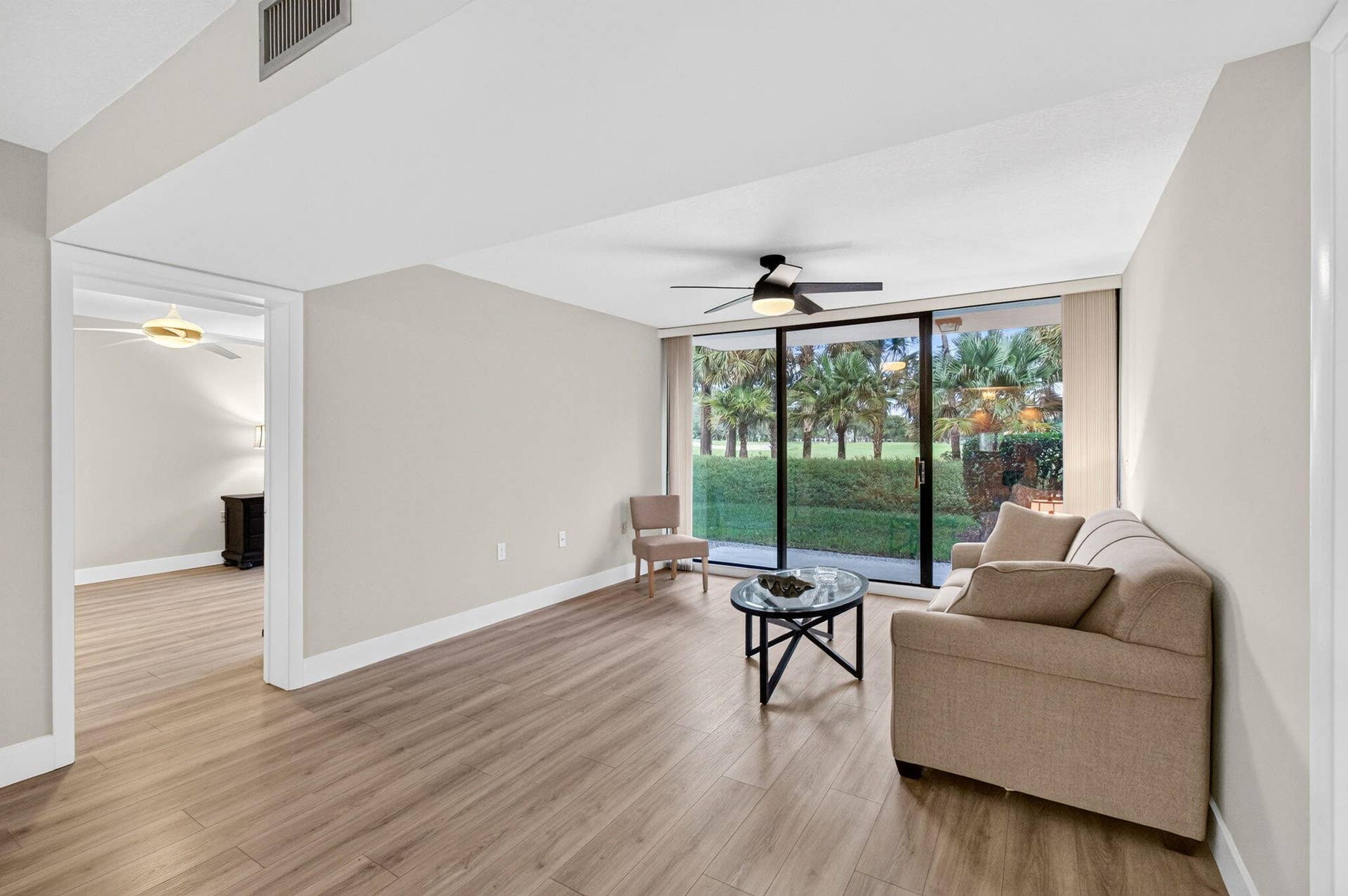 6169 Balboa Circle, #103, Boca Raton, FL 33433 Walk out Patio with golf course view. Freshly painted with new laminate floors
