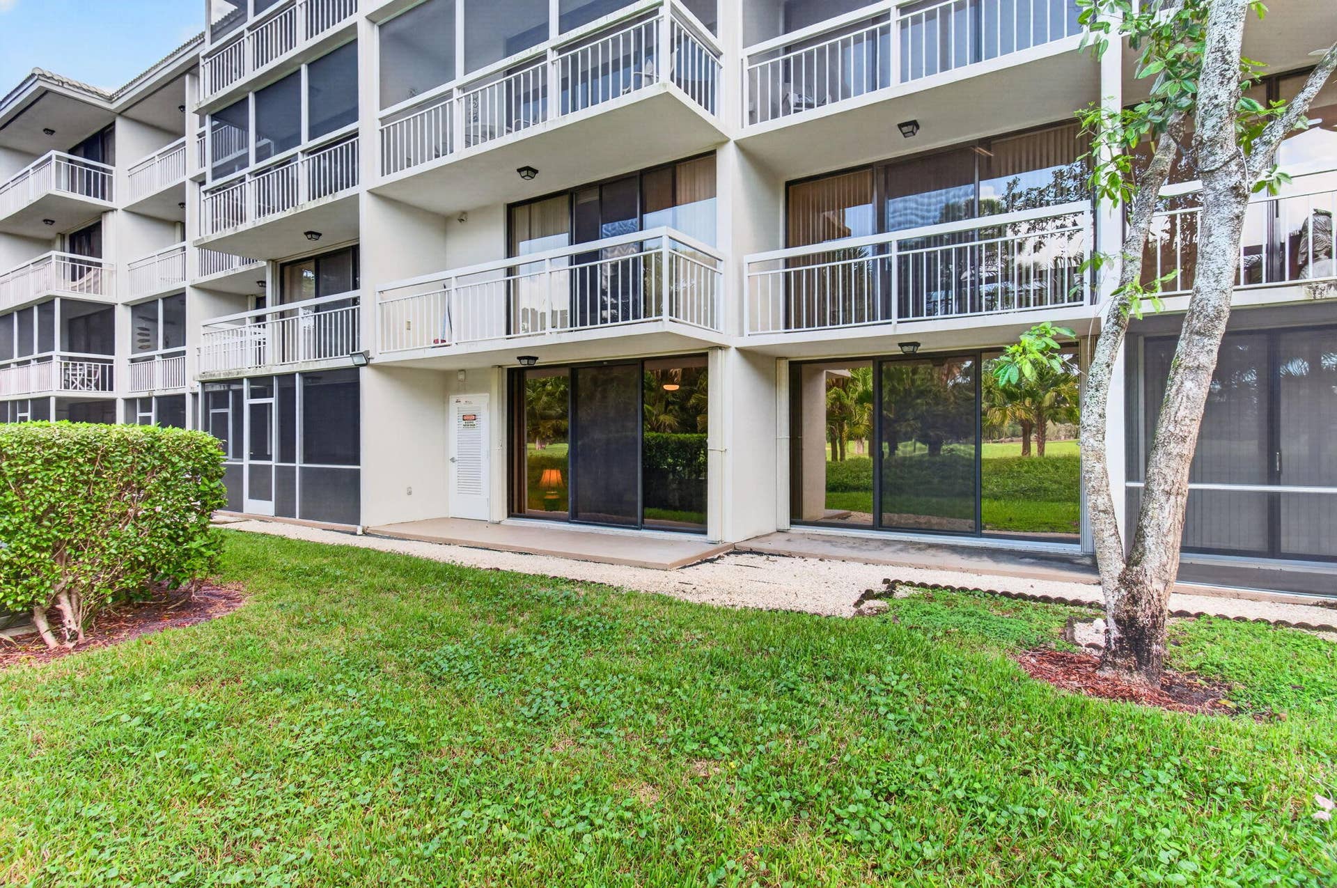 6169 Balboa Circle, #103, Boca Raton, FL 33433 Walk out patio with accordian shutters for added protection