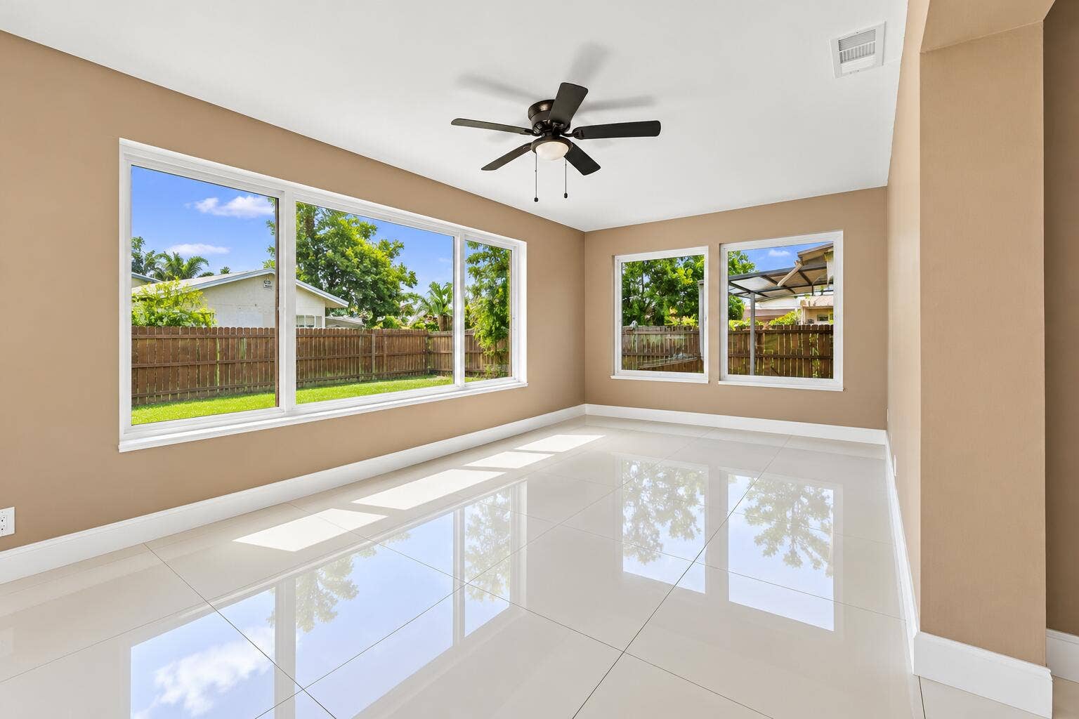 Sunlit Empty Room with Glossy Floors