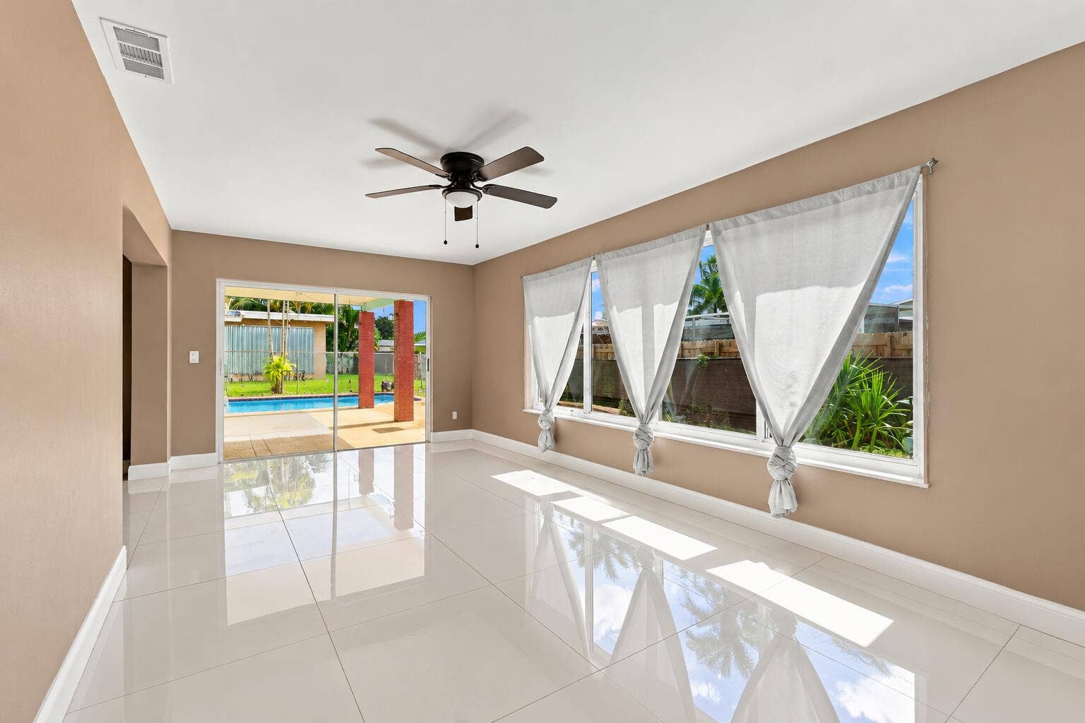 Bright Empty Living Space with Pool View