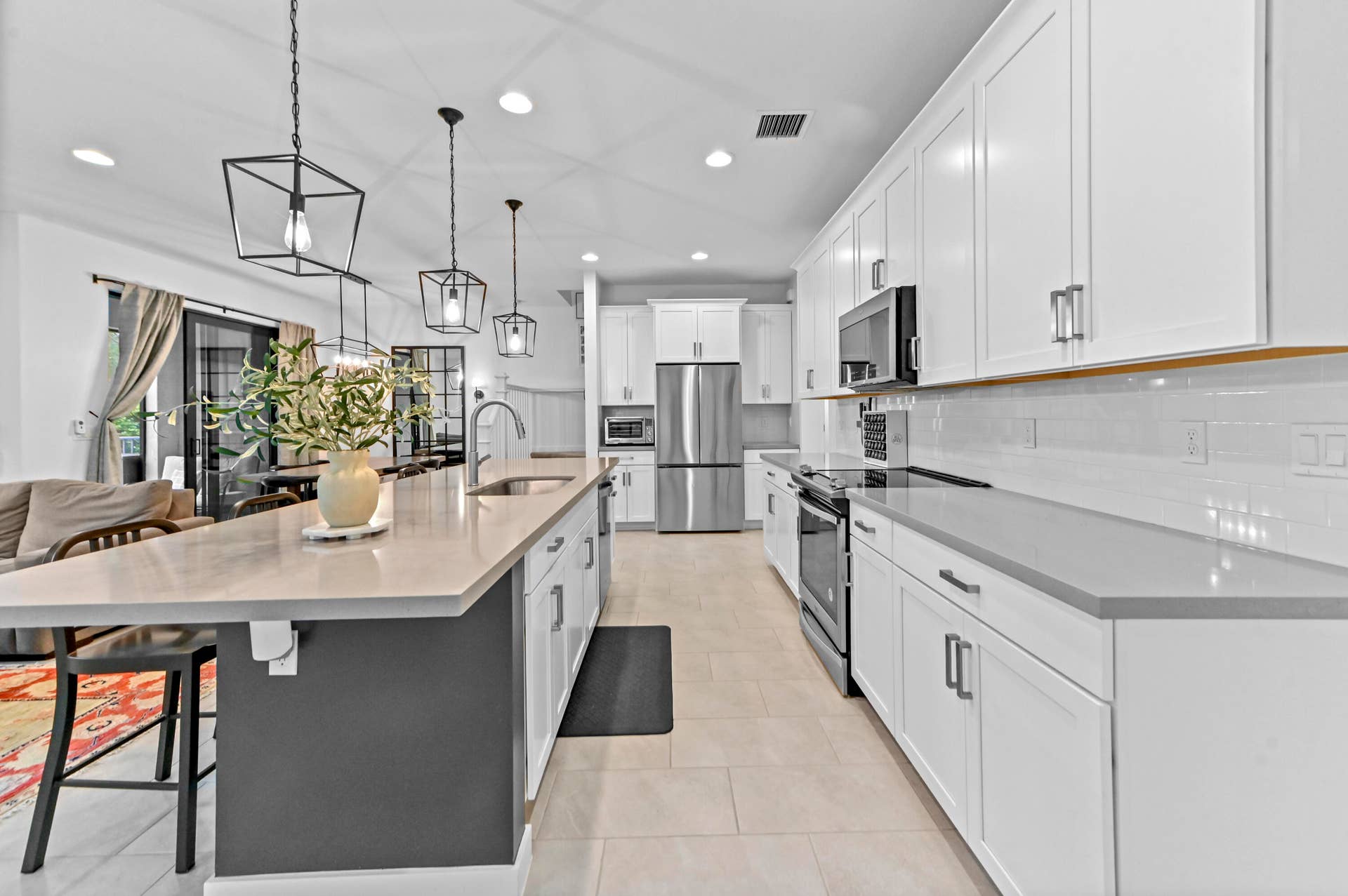 8728 Corvus Drive, Lake Worth, FL 33467 Gourmet kitchen with stainless steel appliances and quartz counters