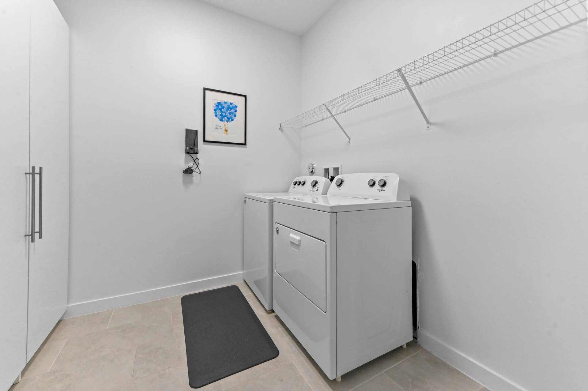 8728 Corvus Drive, Lake Worth, FL 33467 Laundry Room on second floor with full size washer/dryer and storage closet