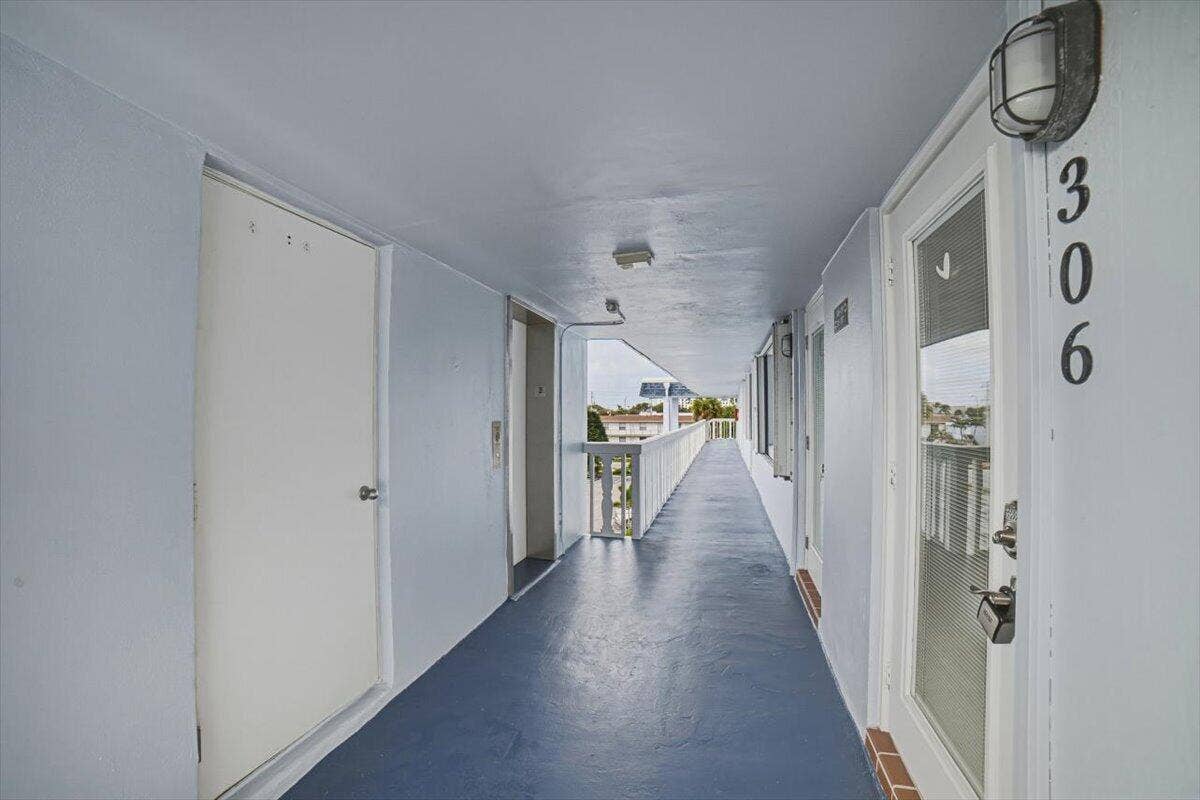 131 Doolen Court, #306, North Palm Beach, FL 33408 Front Entrance Near Laundry & Elevator