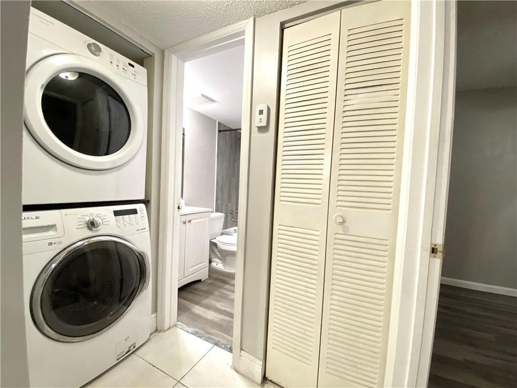 2967 RIVERSIDE Drive, #109, Coral Springs, FL 33065 guest bathroom washer/dryer AC closet