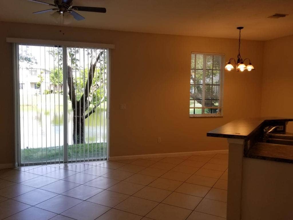 984 LUCAYA Drive, Riviera Beach, FL 33404 Florida room to lake view