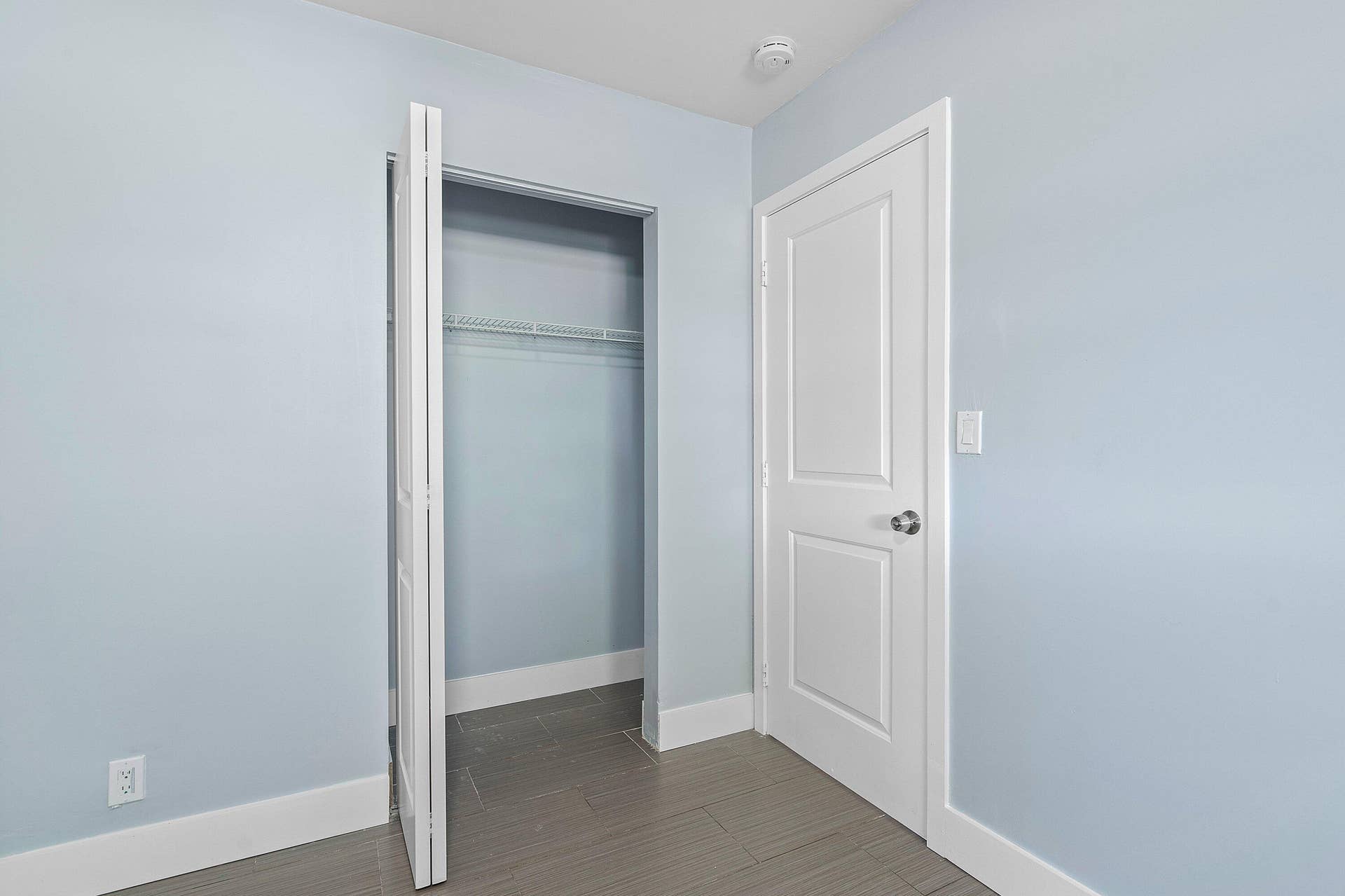 1211 NE 2nd Avenue, Fort Lauderdale, FL 33304 Tile flooring, solid-core interior doors, bifold closet door, and integrated shelving