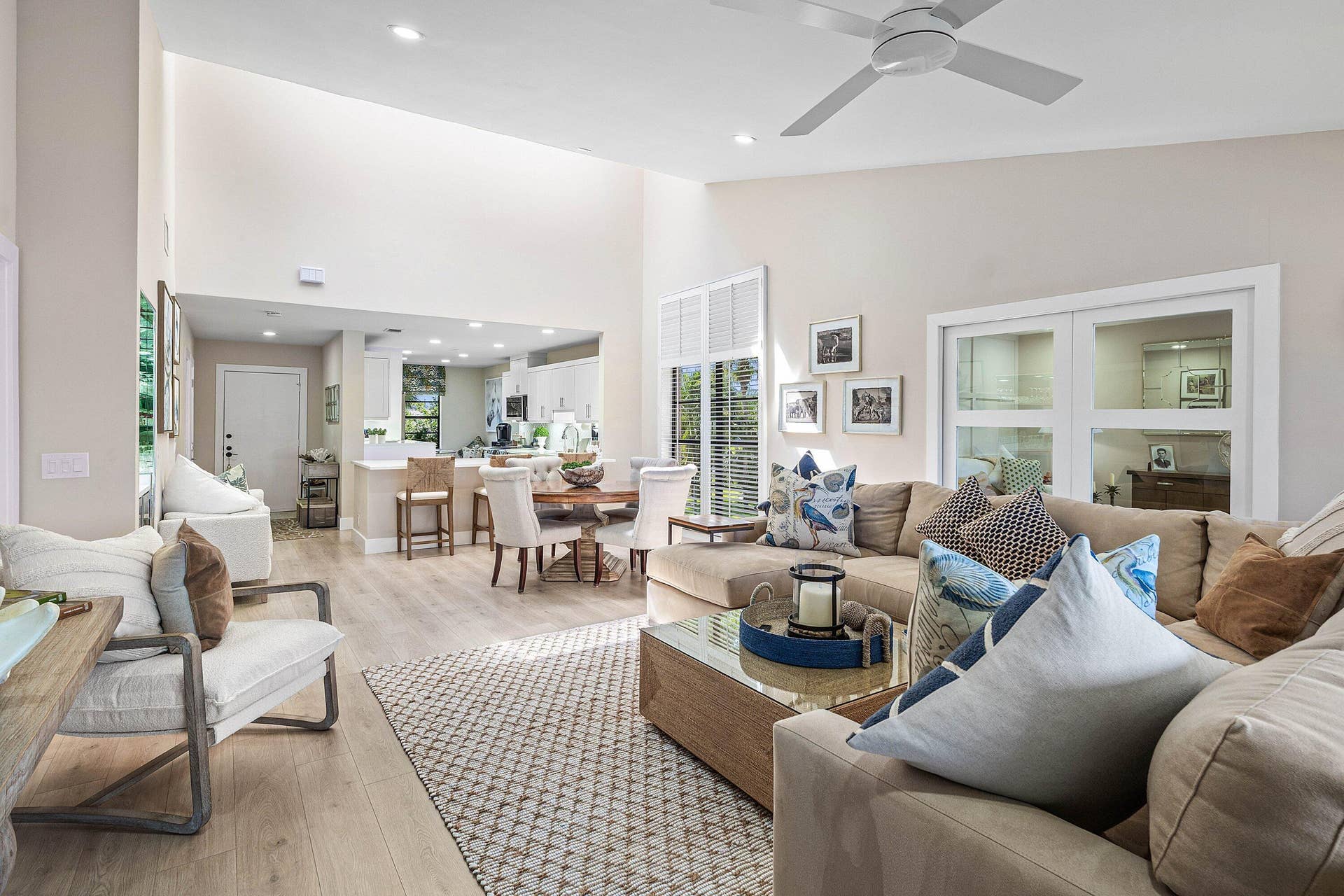 Vaulted ceilings with recessed lighting, wood-finish flooring, and a ceiling fan
