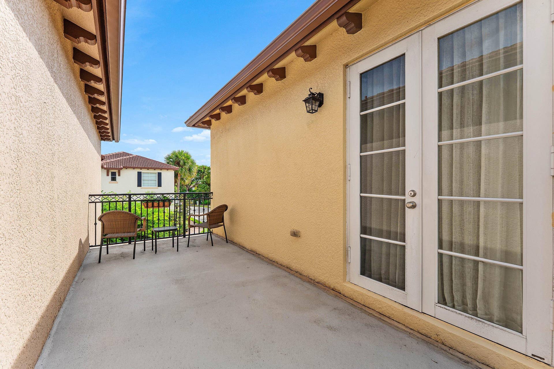 115 VIA POINCIANA Lane, Boca Raton, FL 33487 Private patio with French doors and outdoor living space.