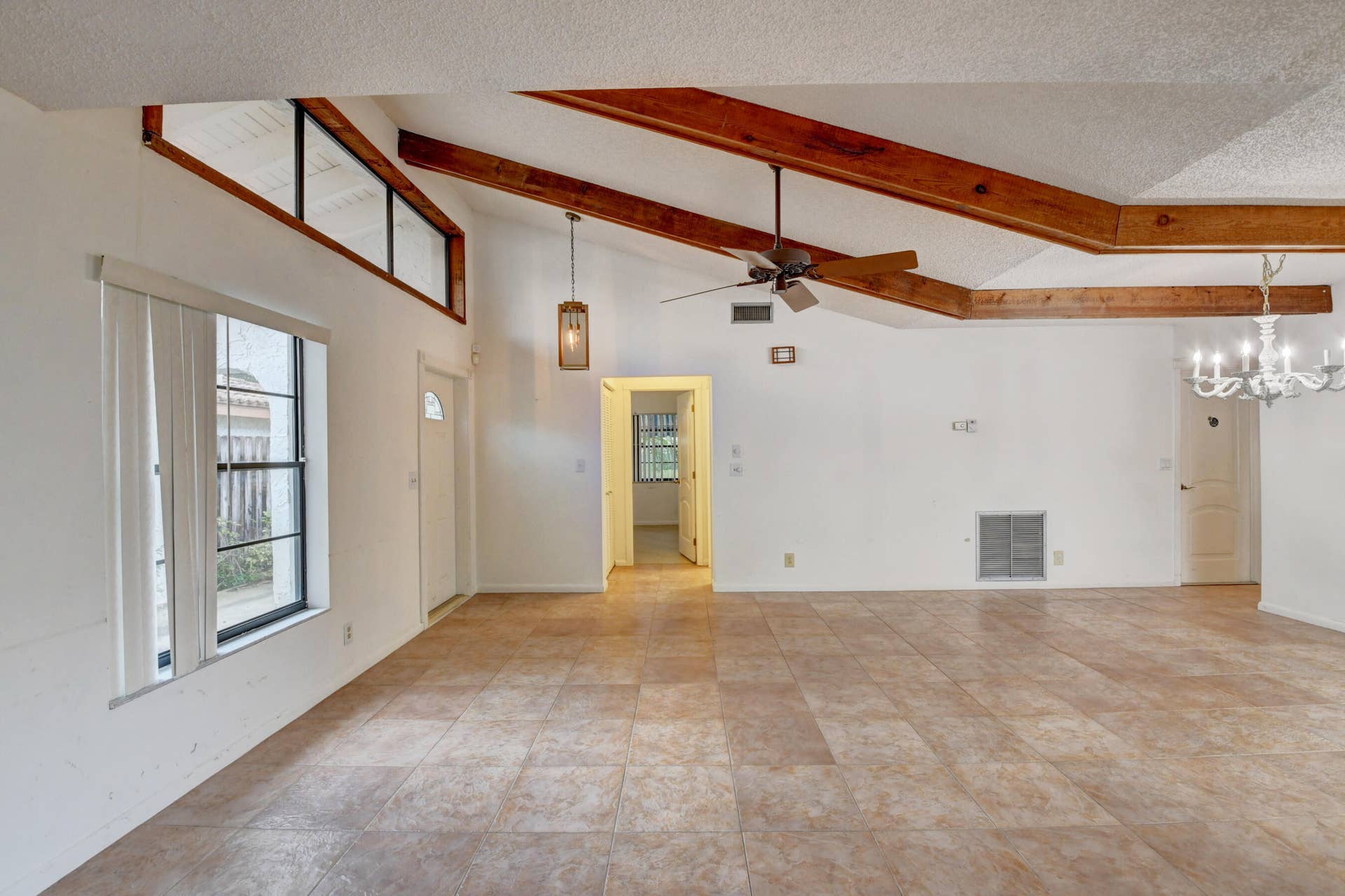 6458 Sweet Maple Lane, Boca Raton, Boca Raton, FL 33433 Expansive Living Area with Exposed Wood Beams, Tile Flooring & Abundant Natural Light