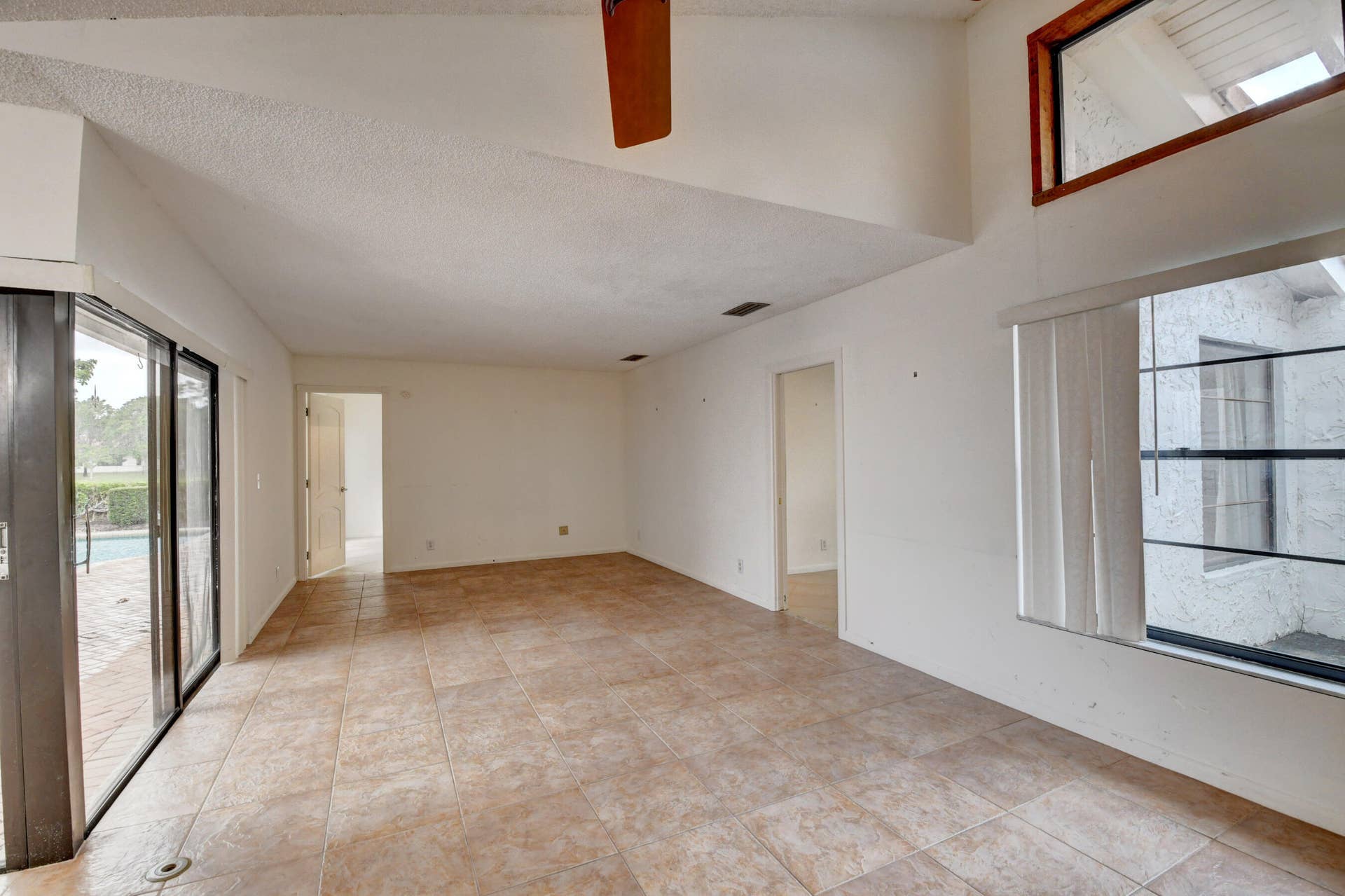 6458 Sweet Maple Lane, Boca Raton, Boca Raton, FL 33433 Expansive Living Area with Exposed Wood Beams, Tile Flooring & Abundant Natural Light