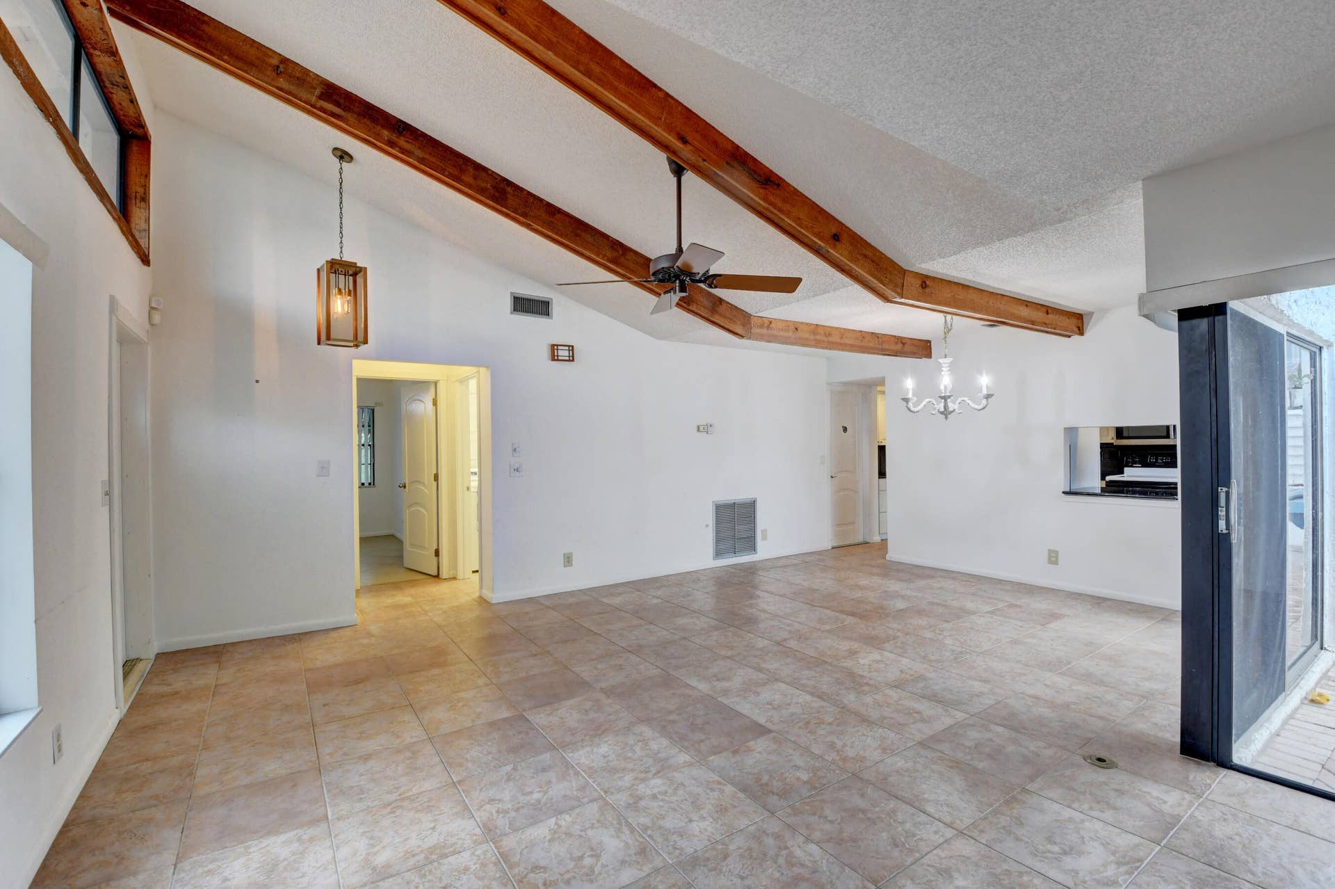6458 Sweet Maple Lane, Boca Raton, Boca Raton, FL 33433 Expansive Living Area with Exposed Wood Beams, Tile Flooring & Abundant Natural Light