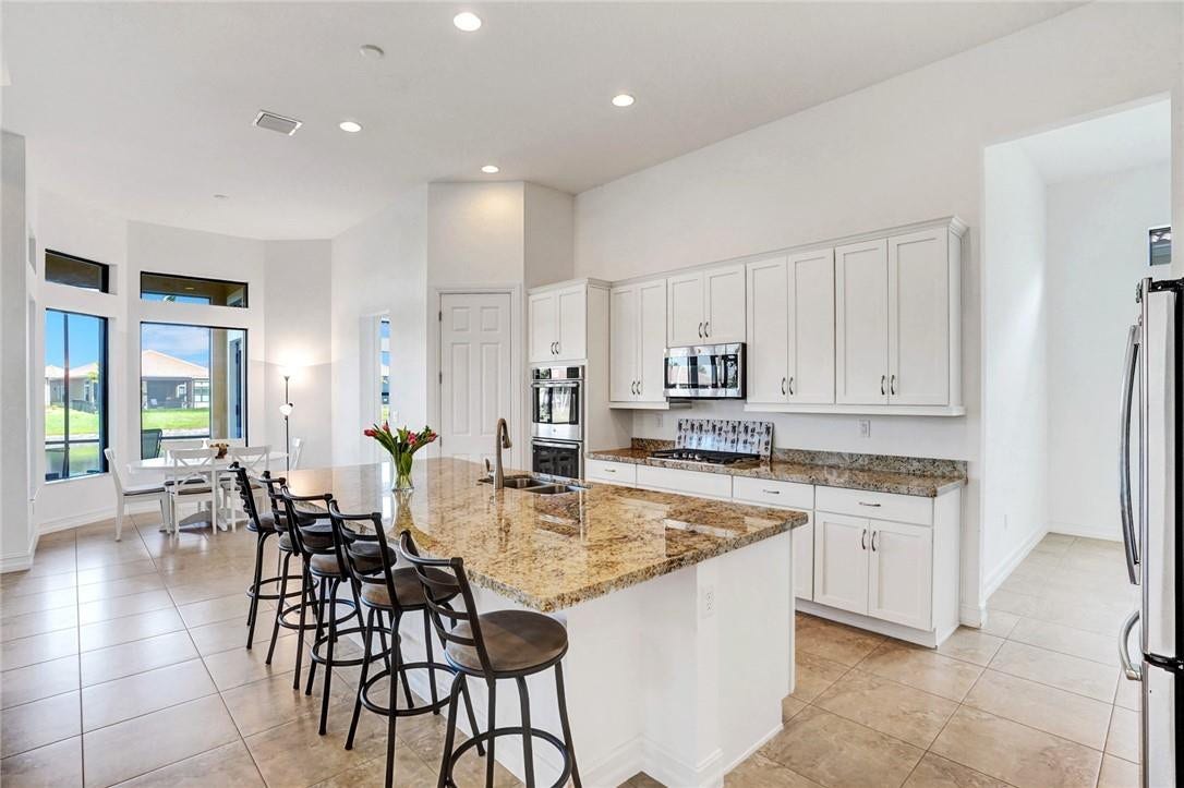 9567 KARLBERG Way, Parkland, FL 33076 Watch the lake while cooking on the gas burners!