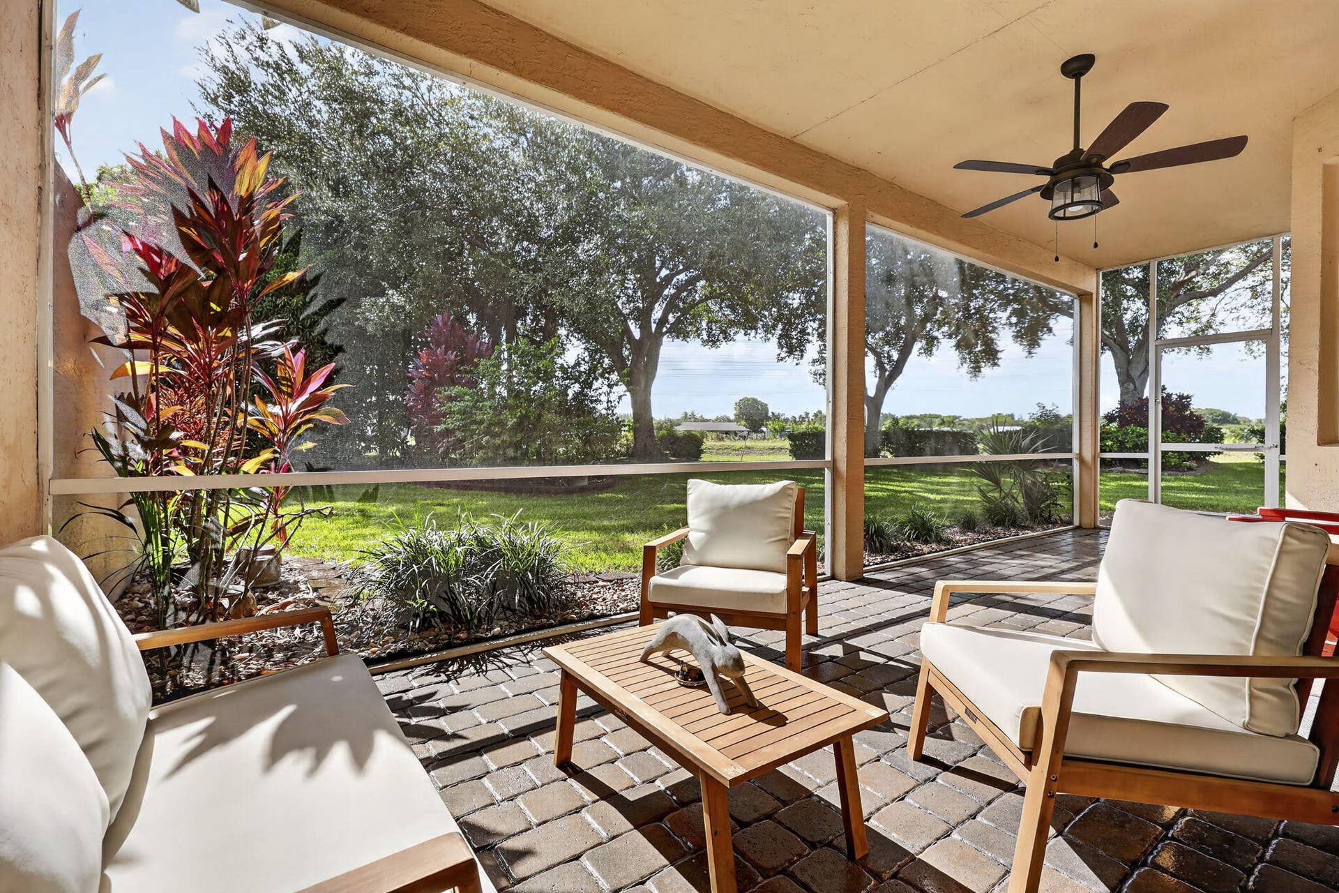 273 BERENGER Walk, Royal Palm Beach, FL 33414 Covered and screened patio with garden view No rear neighbors