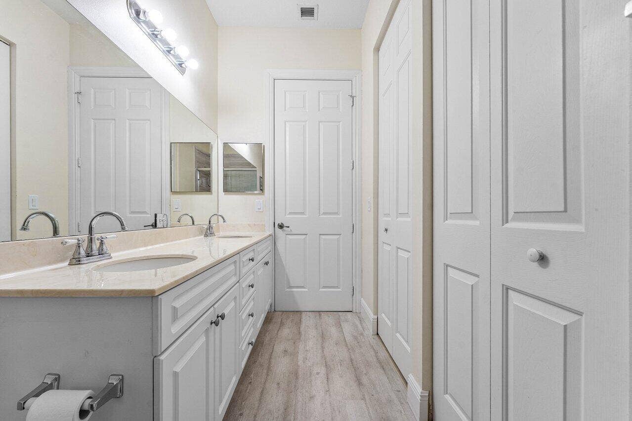 2611 VENETIAN Drive, Boynton Beach, FL 33426 Large His-and-Hers Walk-In Closets on the right