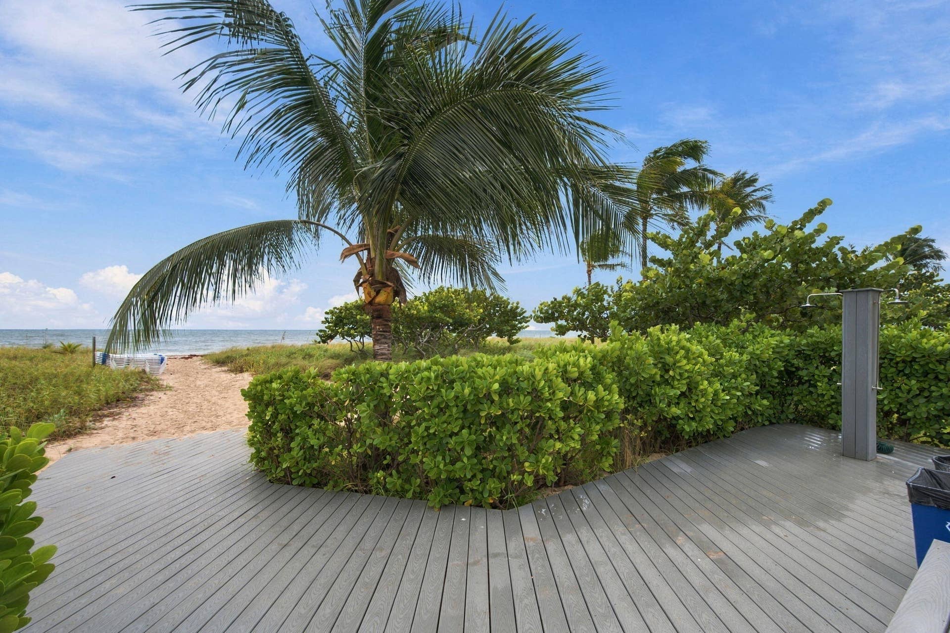RINSE OFF ON YOUR WAY BACK IN FROM THE BEACH UNDER THE PLEASANT FEELING OUTDOOR SHOWER.