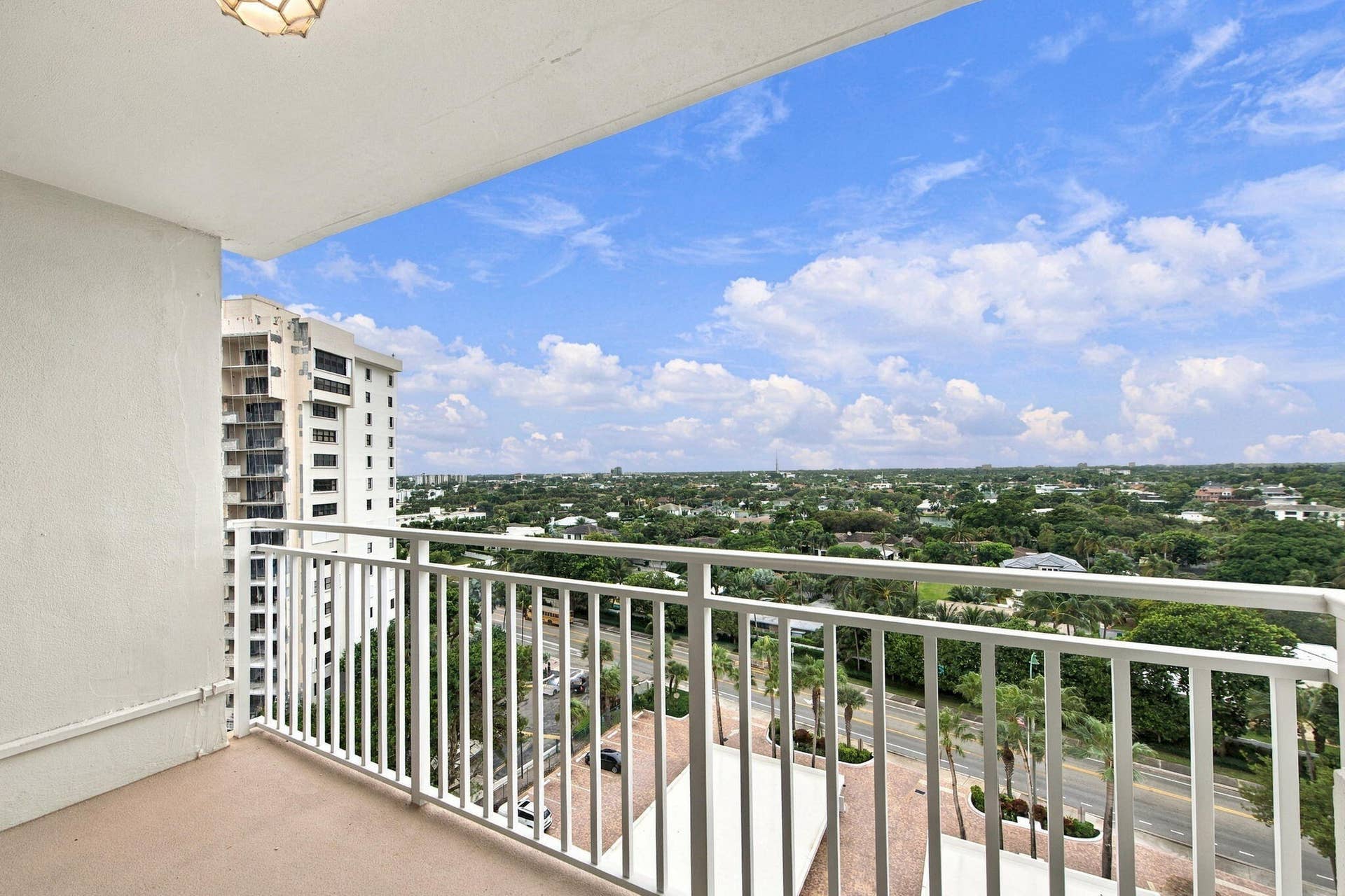 VIEW IS PEEKS AT THE INTRACOASTAL, LUSH GREENERY AND THE OUTLINE OF THE CITY. SEE SPECTACULAR SUNSETS & CITY LIGHTS IN THE EVENING.