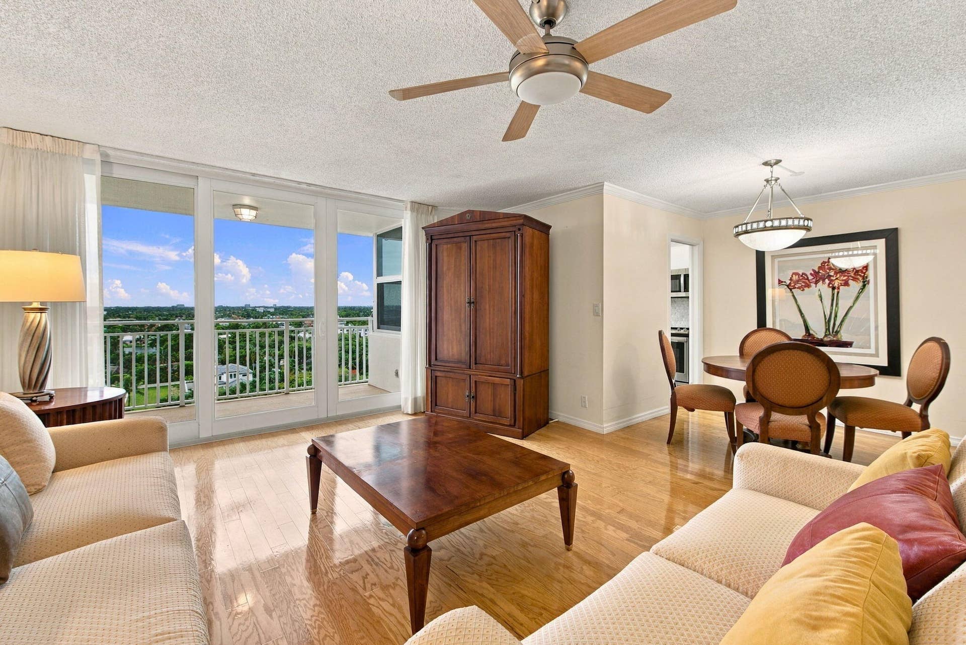 APT. 1112 HAS ALL HIGH IMPACT GLASS AND SOLID OAK FLOORS THROUGHOUT EXCEPT FOR KITCHEN WHICH HAS WOOD LOOK GRAY TILE.