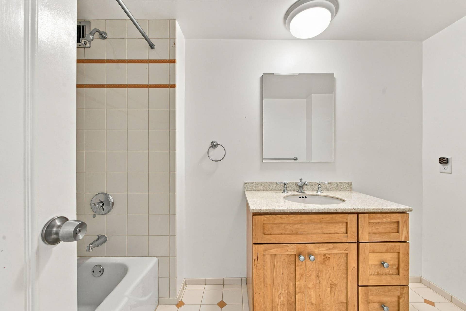 2ND FULL BATH WITH TUB AND SHOWER COMBO ACROSS HALLWAY FROM GUEST BEDROOM