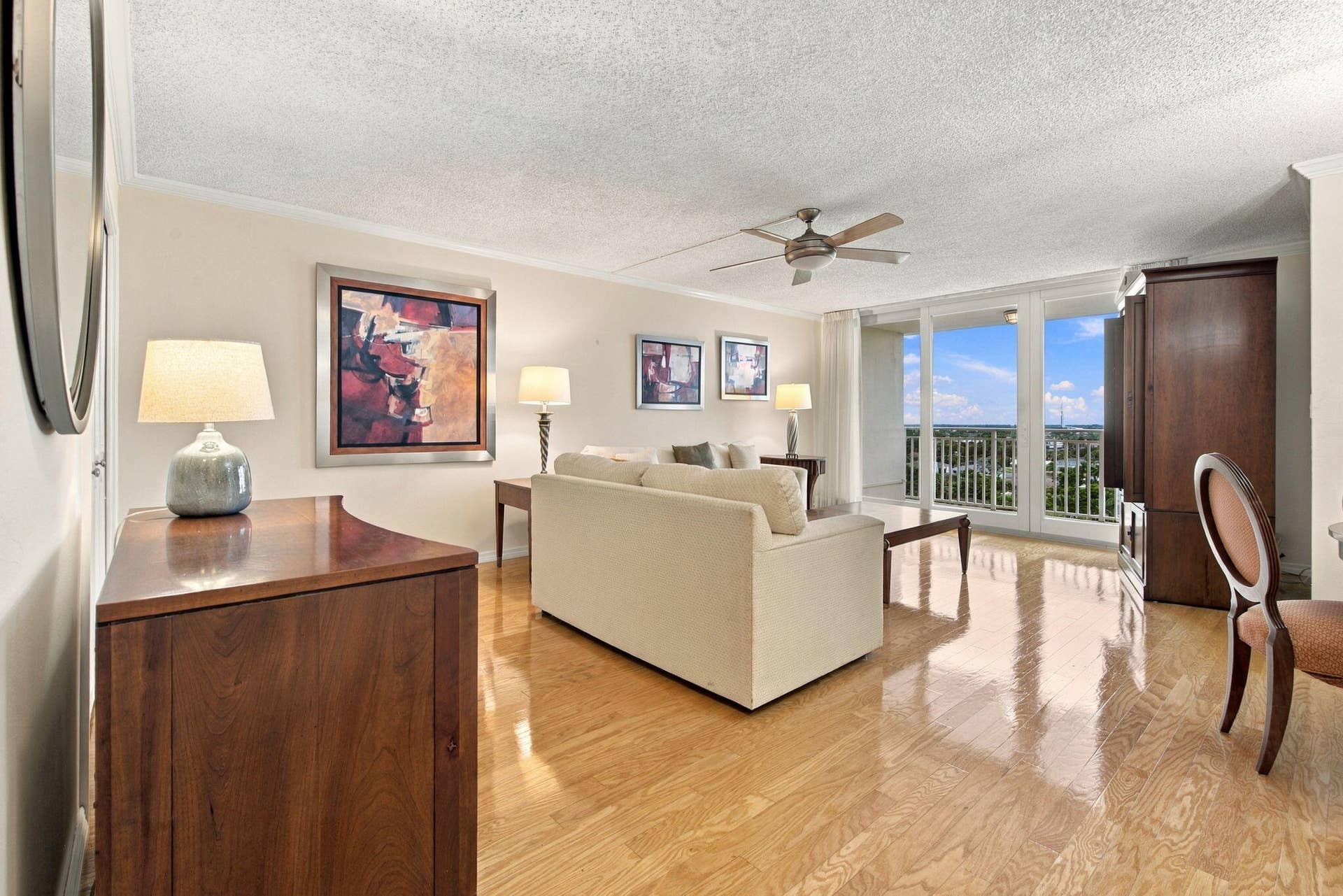 LIVING ROOM LOOKS TOWARDS LARGE BALCONY