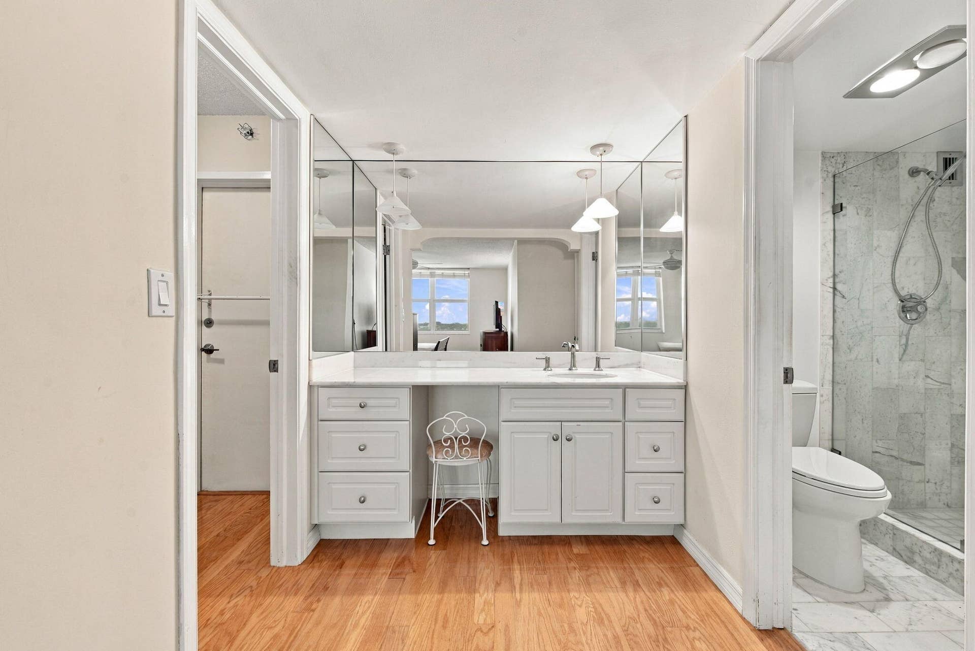 PRIMARY SUITE HAS VANITY, WALK-IN CLOSET AND ENSUITE FULL BATH WITH SHOWER.