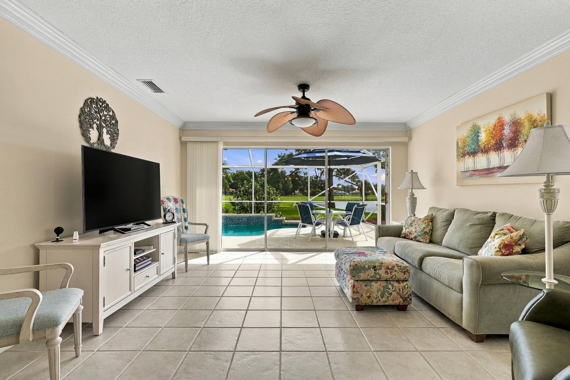 Living room with pool and lake views