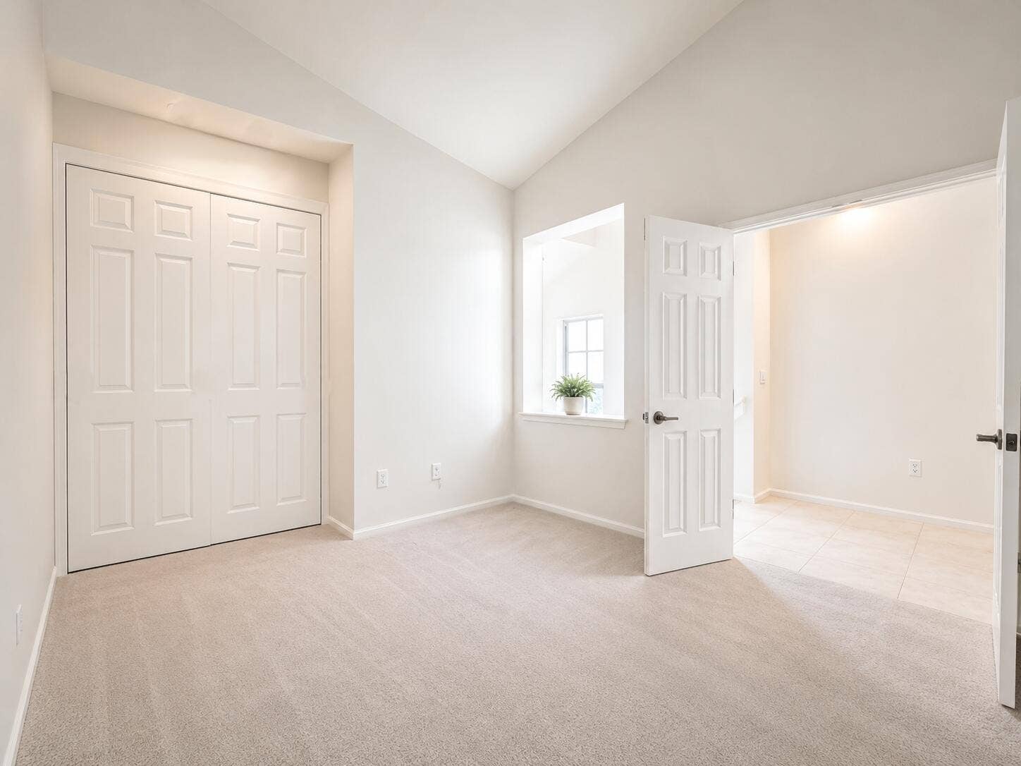 6560 VILLA SONRISA Drive, #1321, Boca Raton, FL 33433 Vaulted ceiling, neutral wall-to-wall carpeting, recessed window sill, and multi-panel interior doors