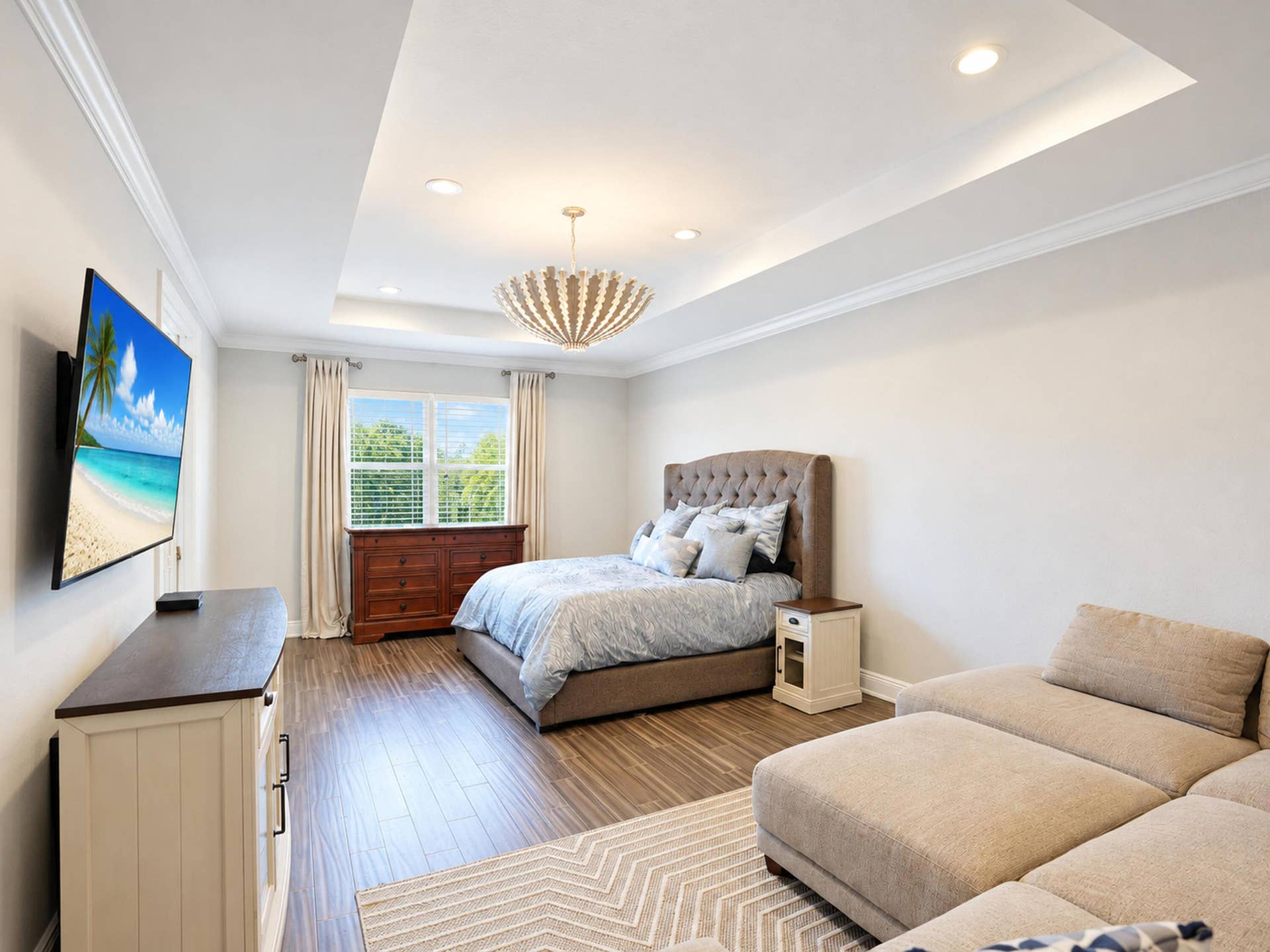 8601 Waterside Court, Parkland, FL 33076 Tray ceiling with recessed lighting, wood-finish flooring, and crown molding