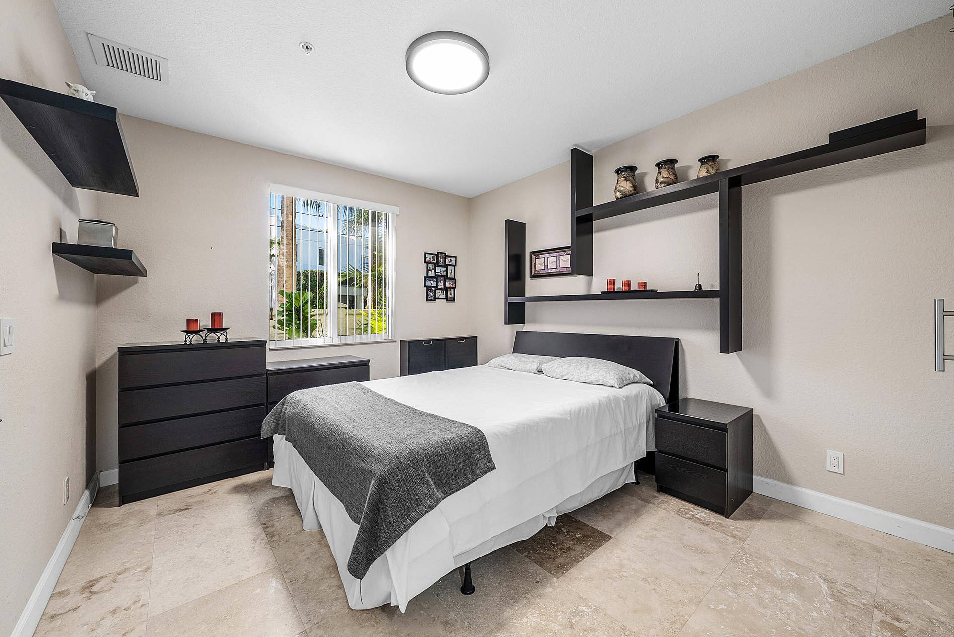 En-suite bedroom with full bath and walk-in closet with barn door