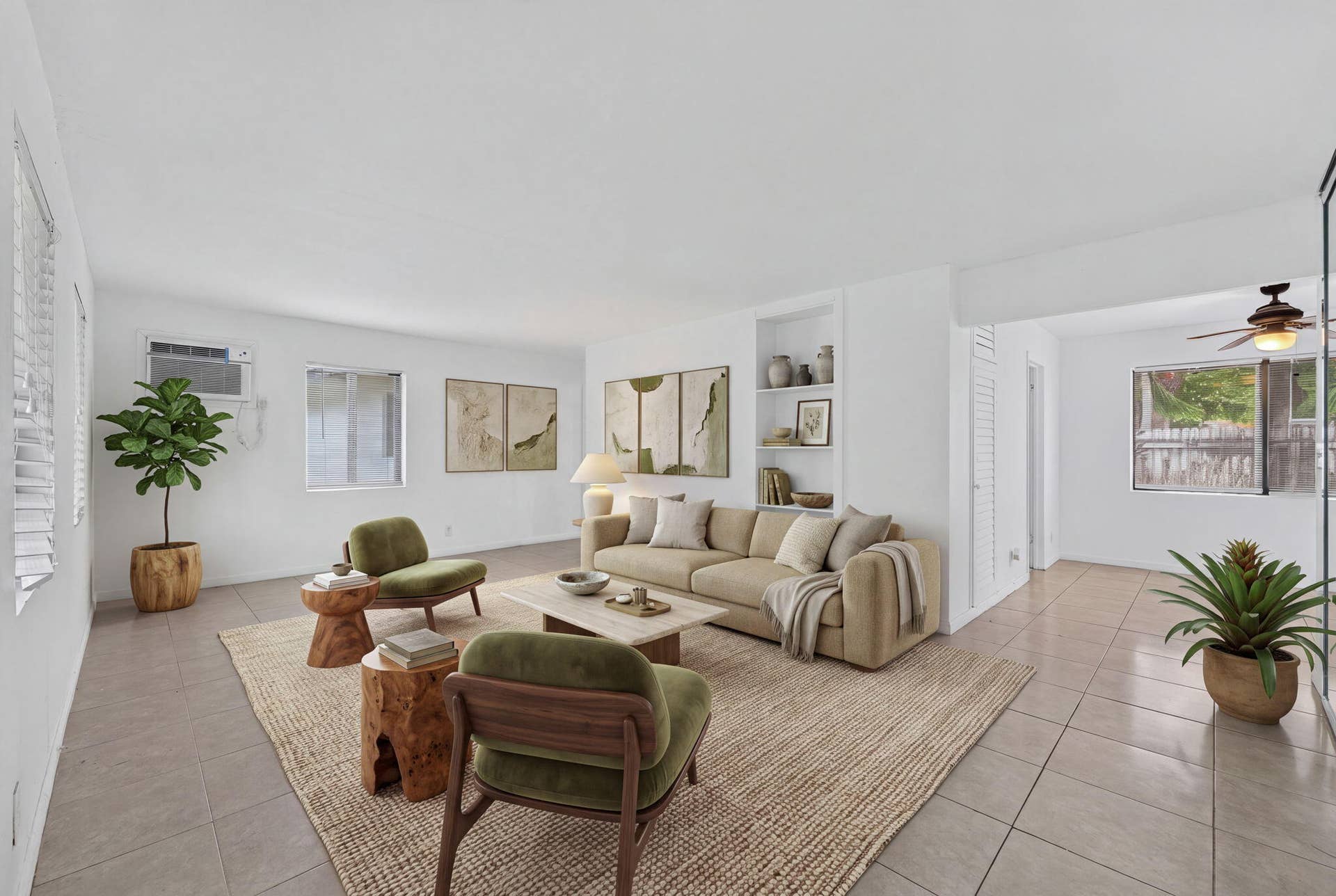1224 NE 5TH Avenue, Fort Lauderdale, FL 33304 Open-concept living space featuring large-format tile flooring, built-in recessed shelving, and a ceiling fan