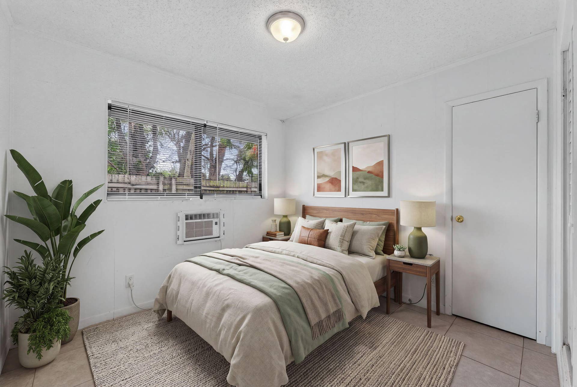 1224 NE 5TH Avenue, Fort Lauderdale, FL 33304 Neutral-toned interior space featuring light-colored tile flooring, flush-mount lighting, and a window with horizontal blinds