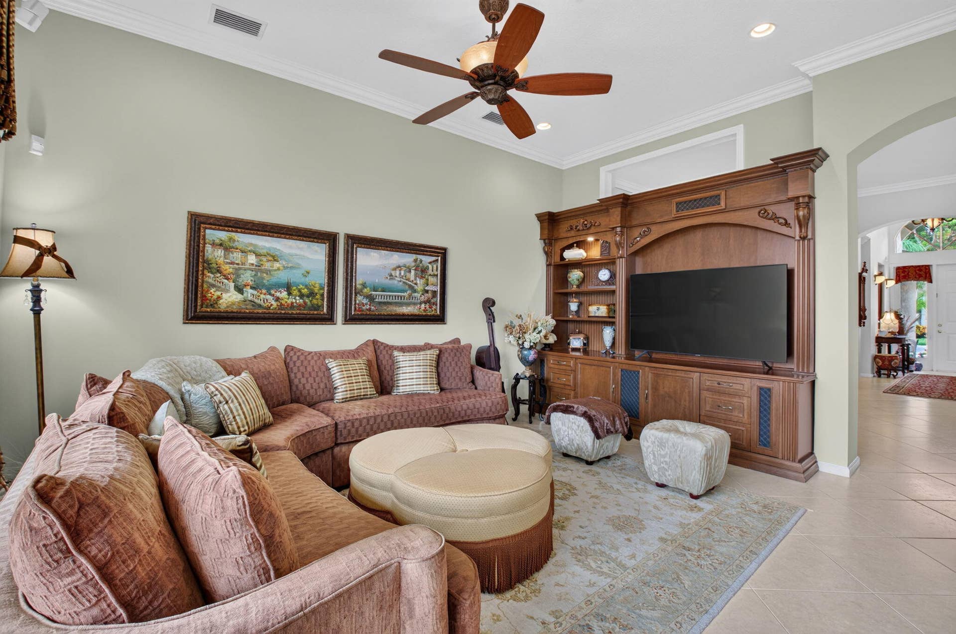 6874 Venidita Beach Drive, Delray Beach, FL 33446 High ceilings with a central ceiling fan and custom built-in wood cabinetry featuring integrated shelving
