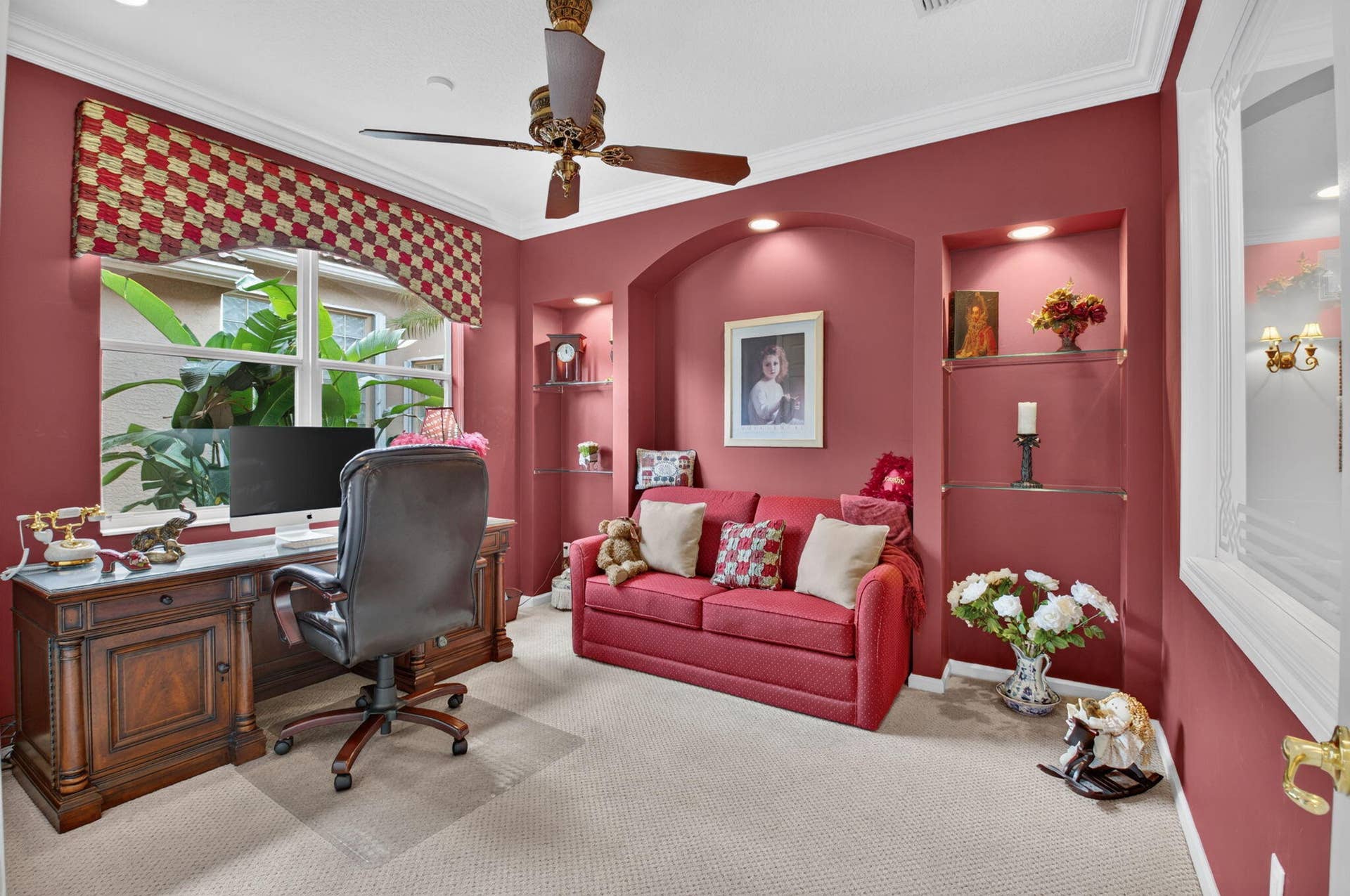 6874 Venidita Beach Drive, Delray Beach, FL 33446 Room featuring dual arched built-in wall niches with recessed lighting and glass shelving, crown molding, and a multi-blade ceiling fan
