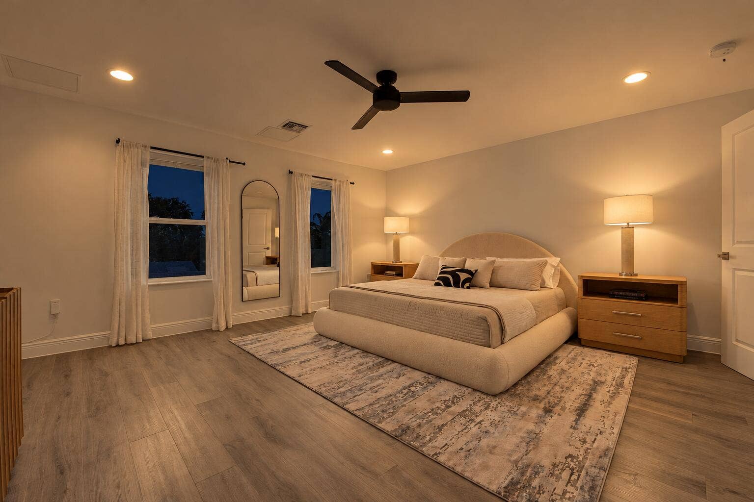 1066 NE 35TH Street, Oakland Park, FL 33334 Spacious room featuring light wood-finish flooring, recessed lighting, and a matte black ceiling fan