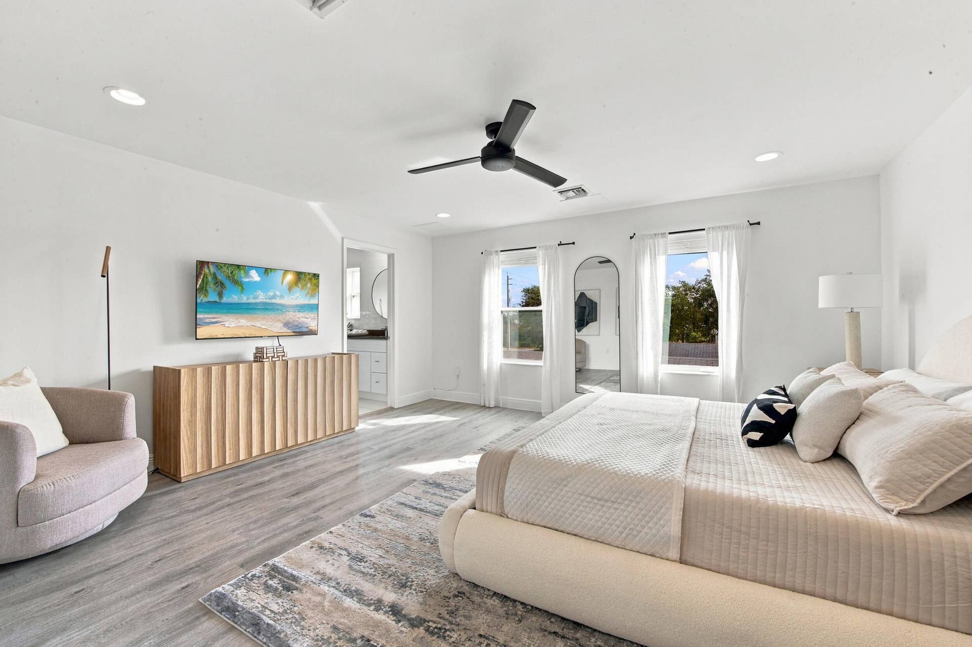 1066 NE 35TH Street, Oakland Park, FL 33334 Room featuring wood-finish flooring, recessed lighting, and a matte black ceiling fan