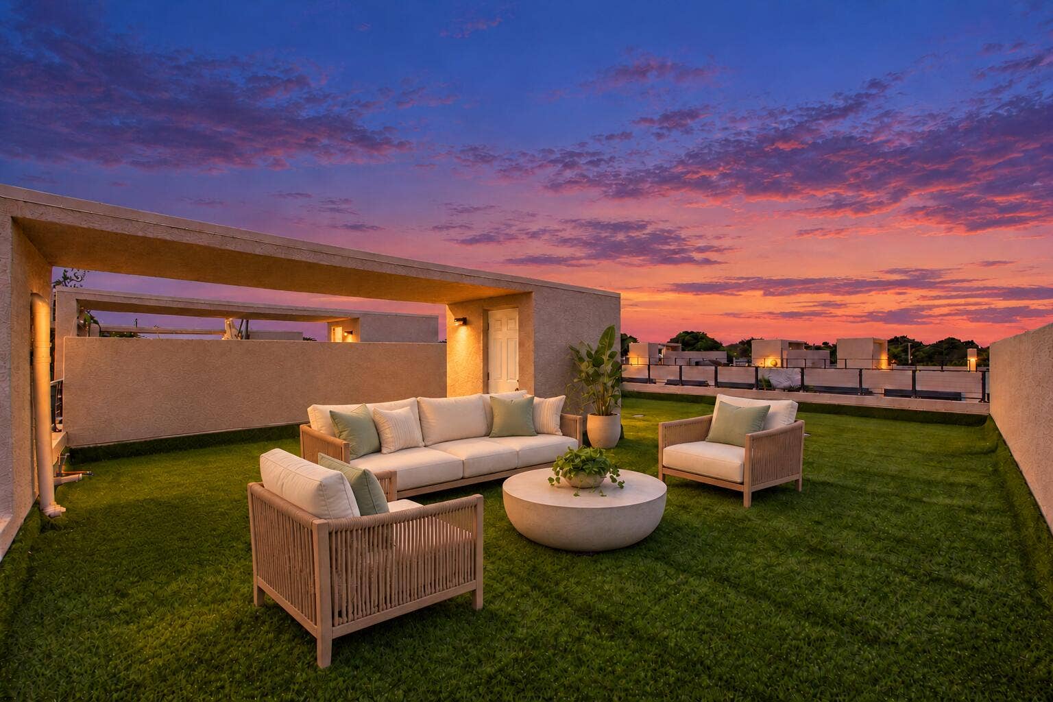 1066 NE 35TH Street, Oakland Park, FL 33334 Expansive rooftop terrace featuring synthetic turf flooring, stucco-finished perimeter walls, and metal railings