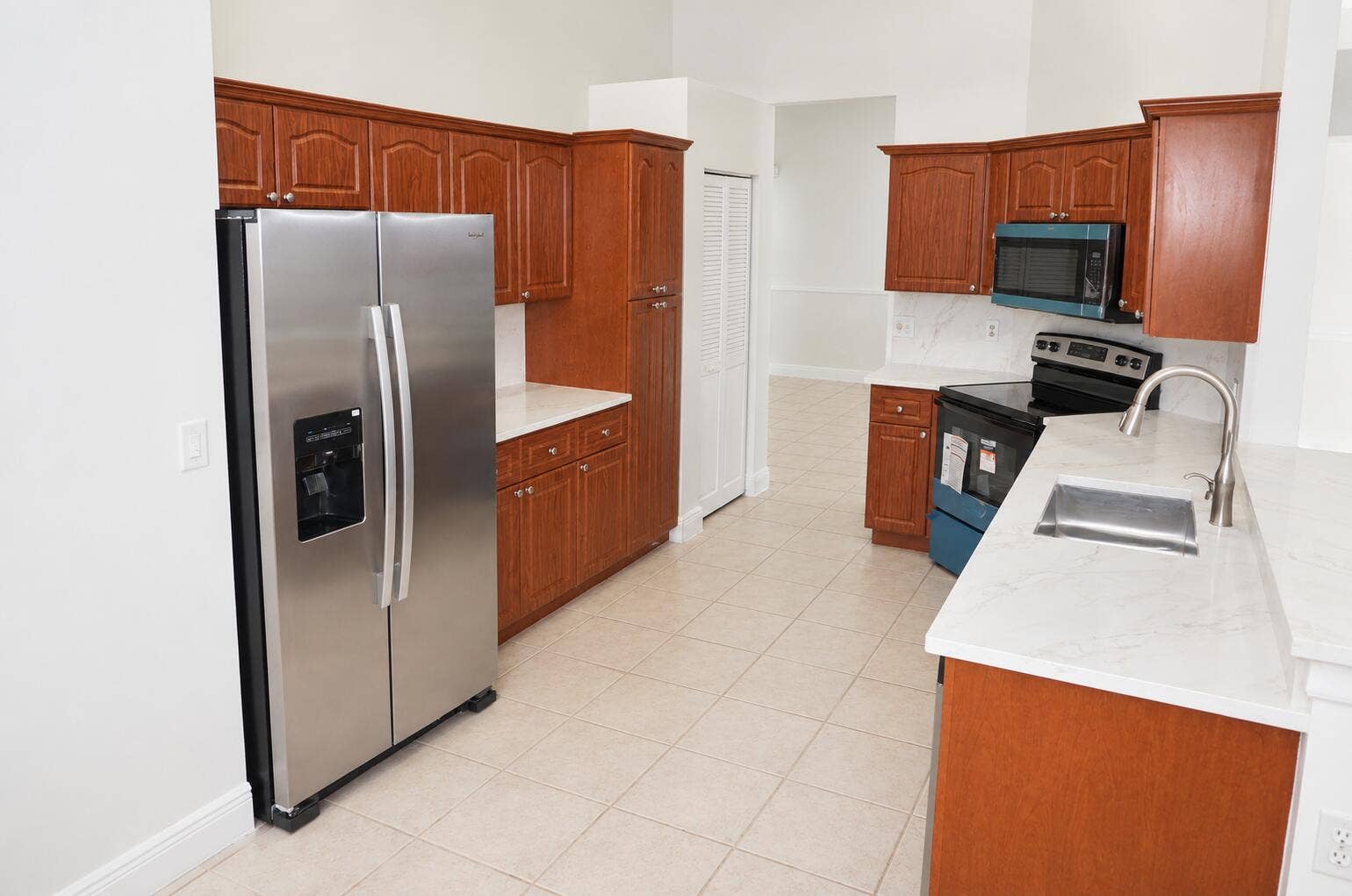 Bright Modern Kitchen with Warm Wood Cab